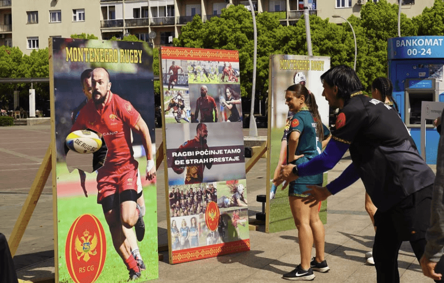 kid with rugby union t-shirt in front of promotion banner