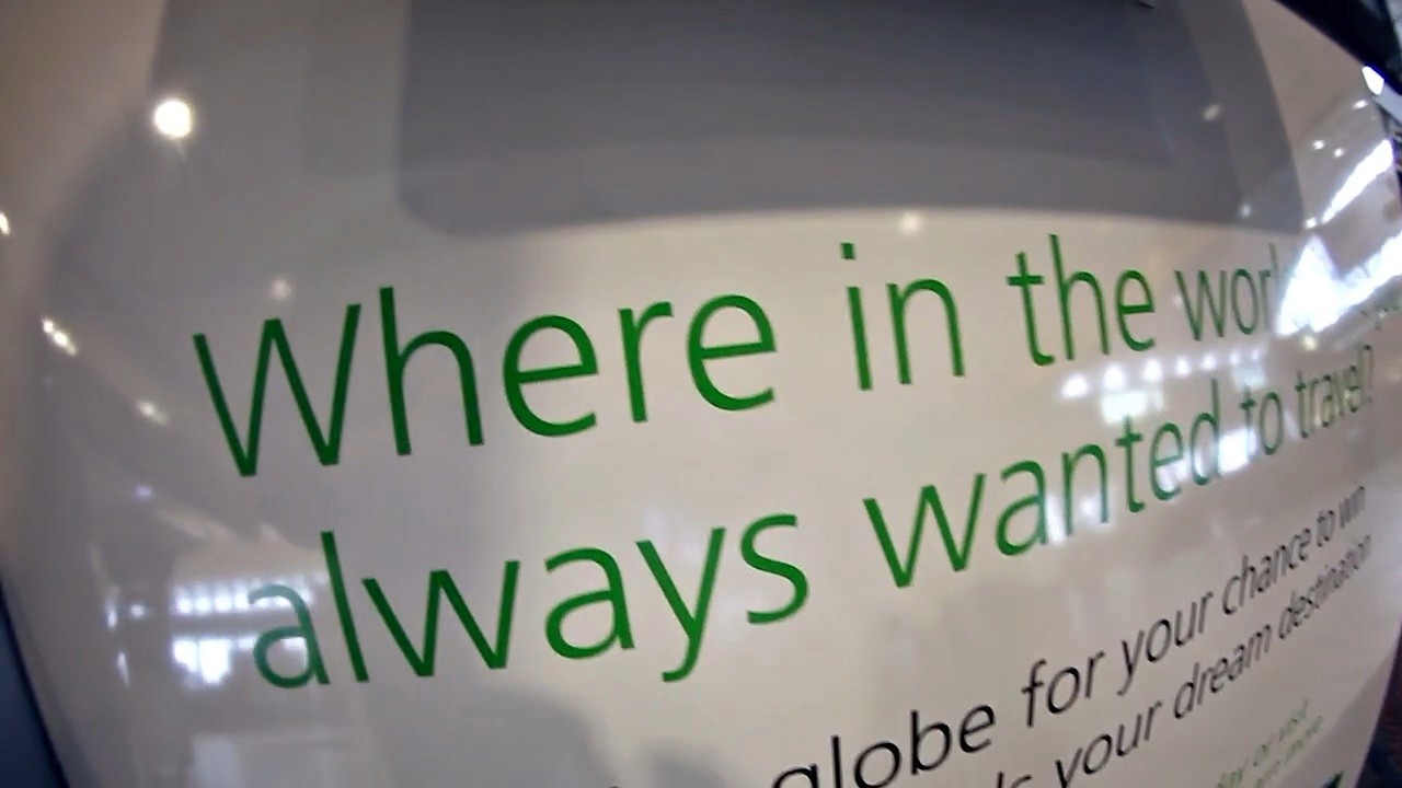 Where in the world have you always wanted to travel? printed on the installation