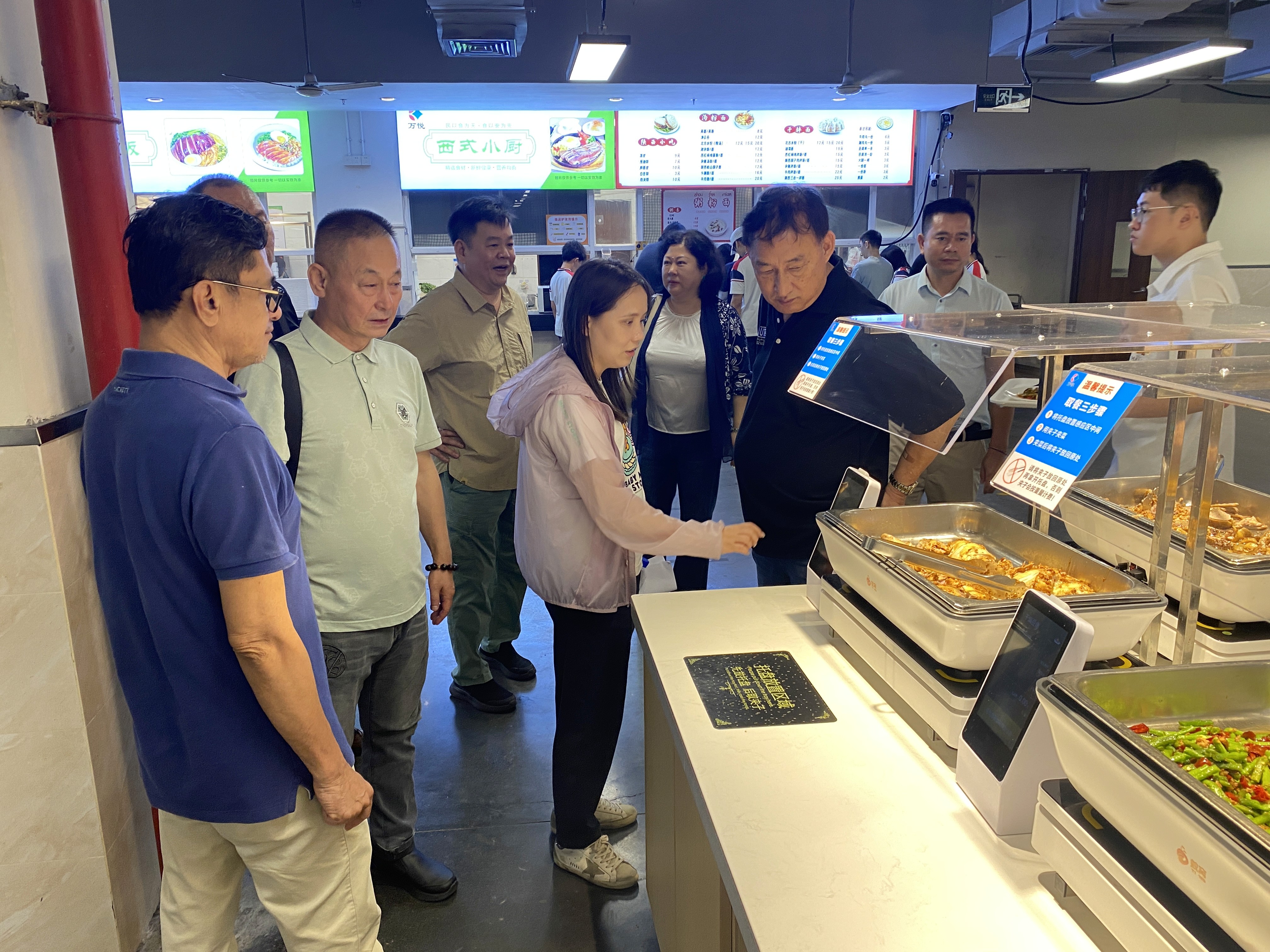 HYEDU delegation tours Siyao School's student canteen facilities during the campus visit