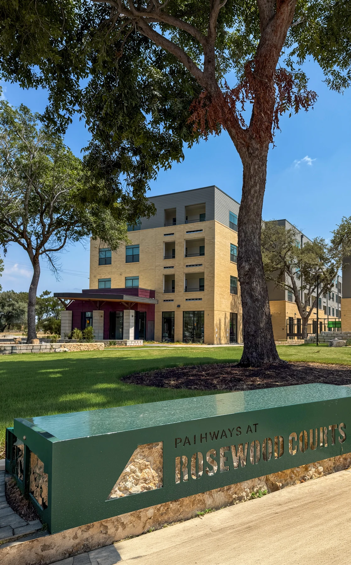 The Pathways at Rosewood Courts sign, courtyard, and new homes