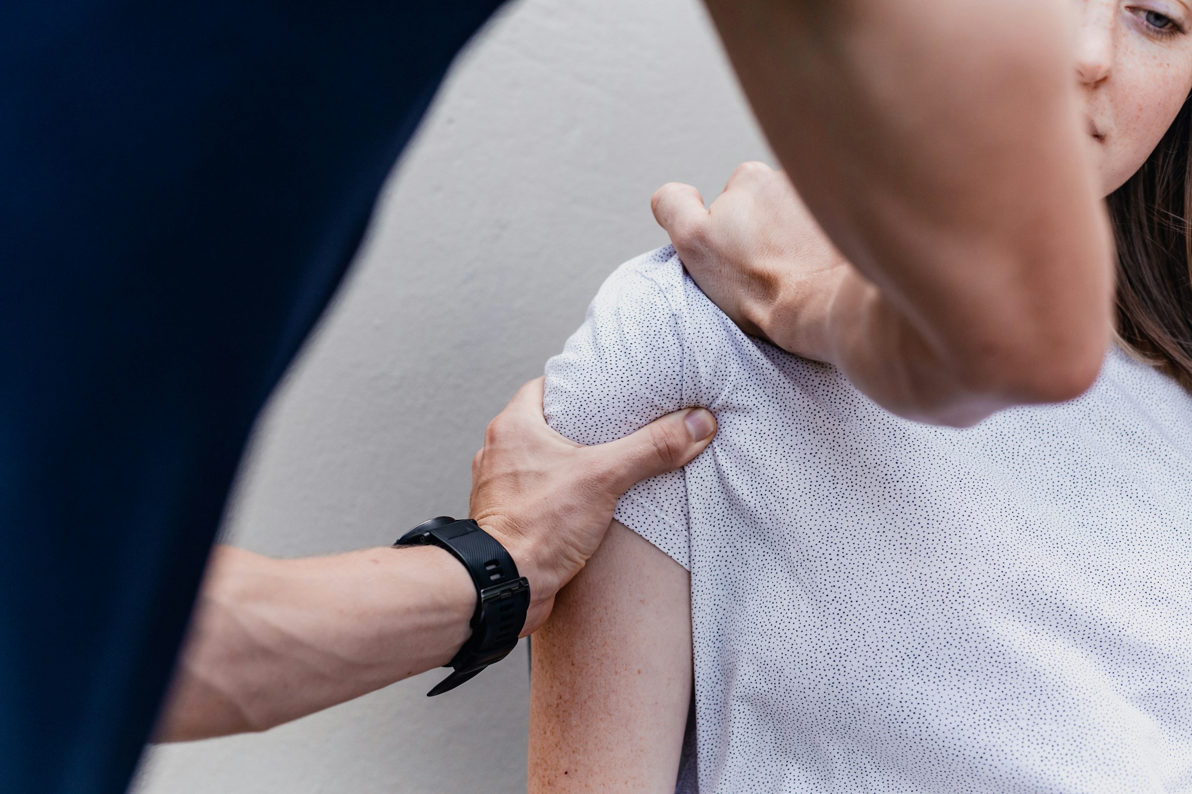 doctor helping a woman - Posture Adjustment Treatment