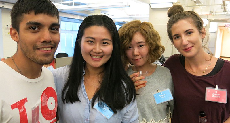 a man and three women smiling