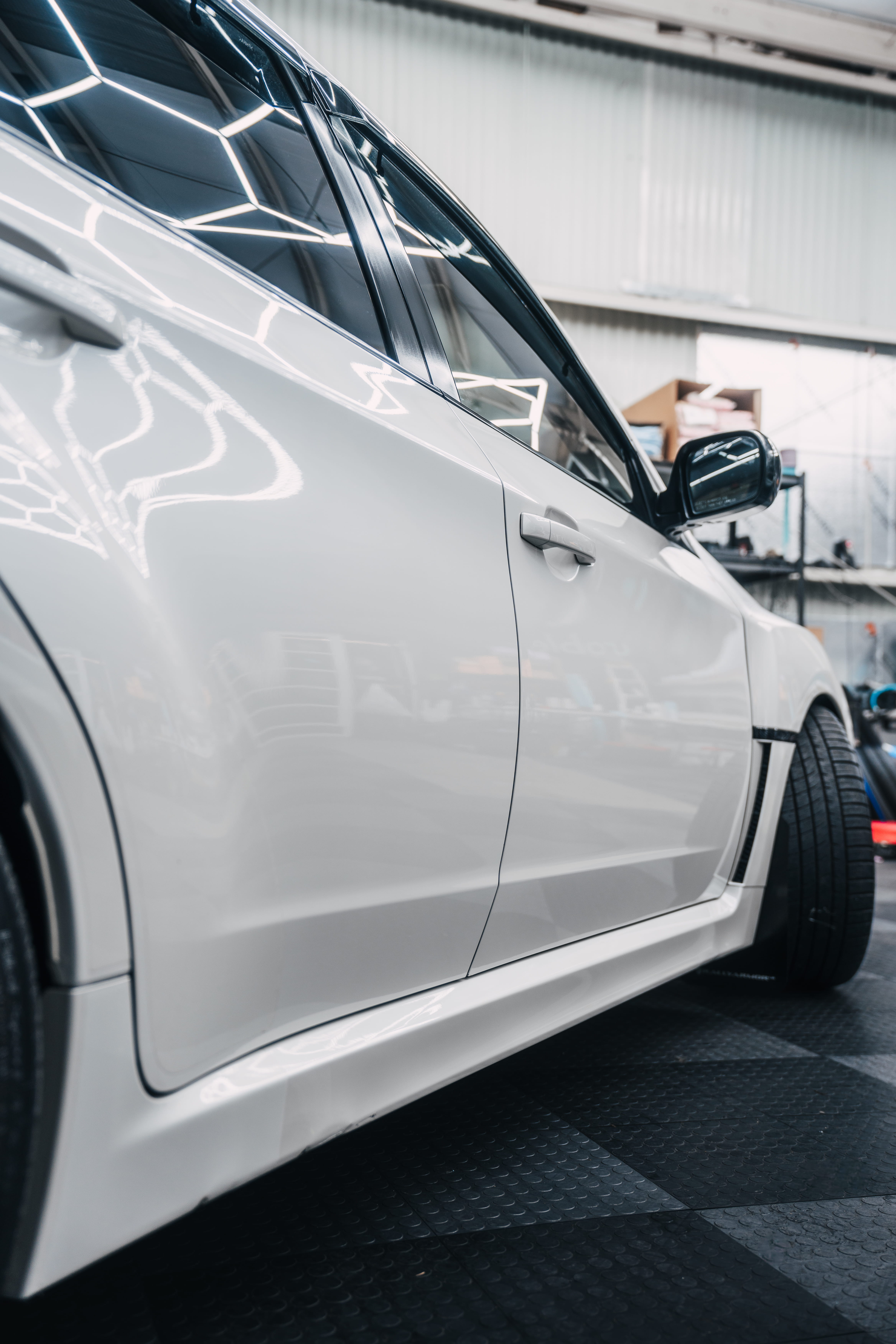 Icon Rocklear permanent paint protection on a white Subaru WRX Hatch, side profile, Dragon Auto Milpitas