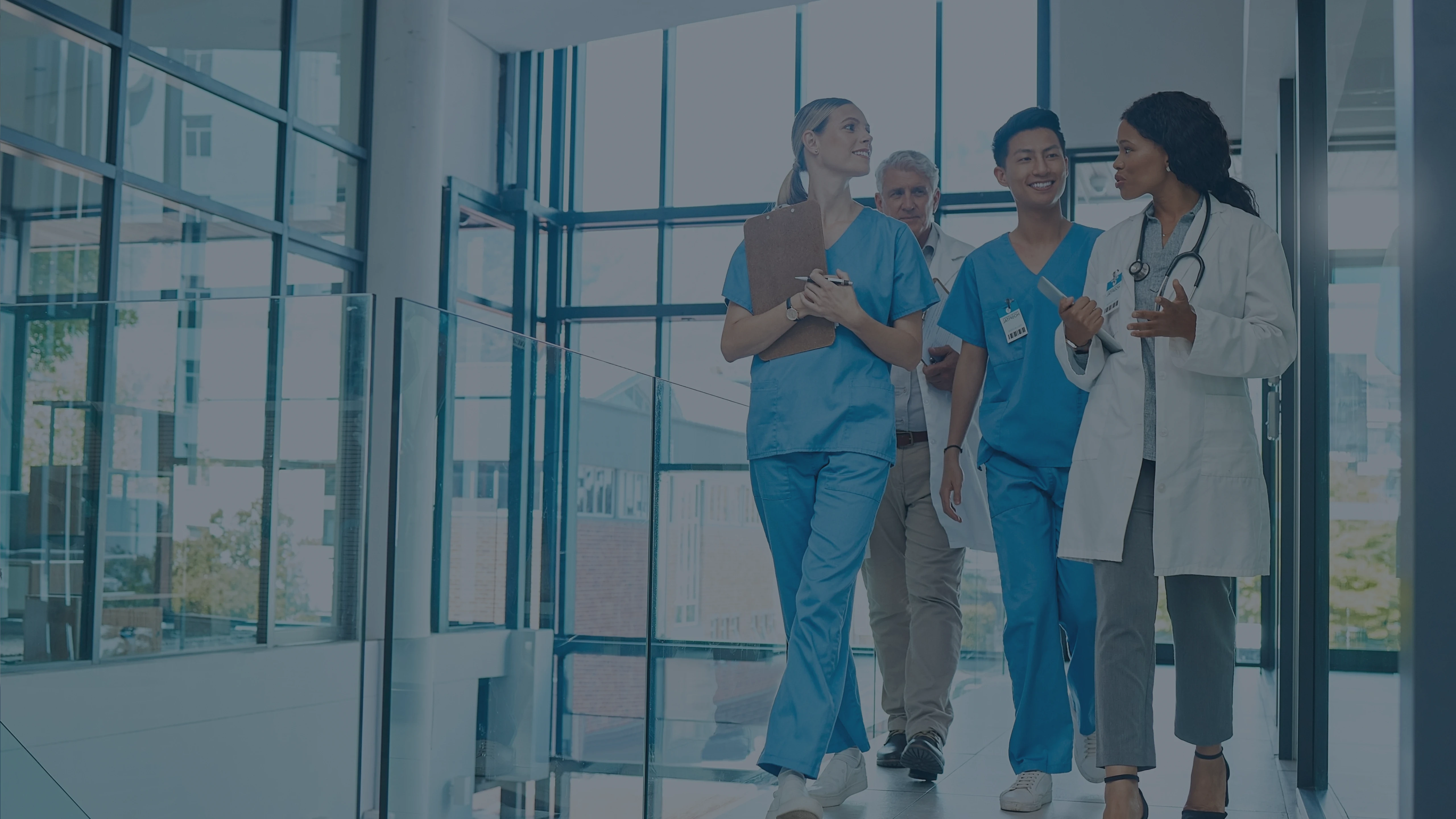 RMGME doctors walking down glass office