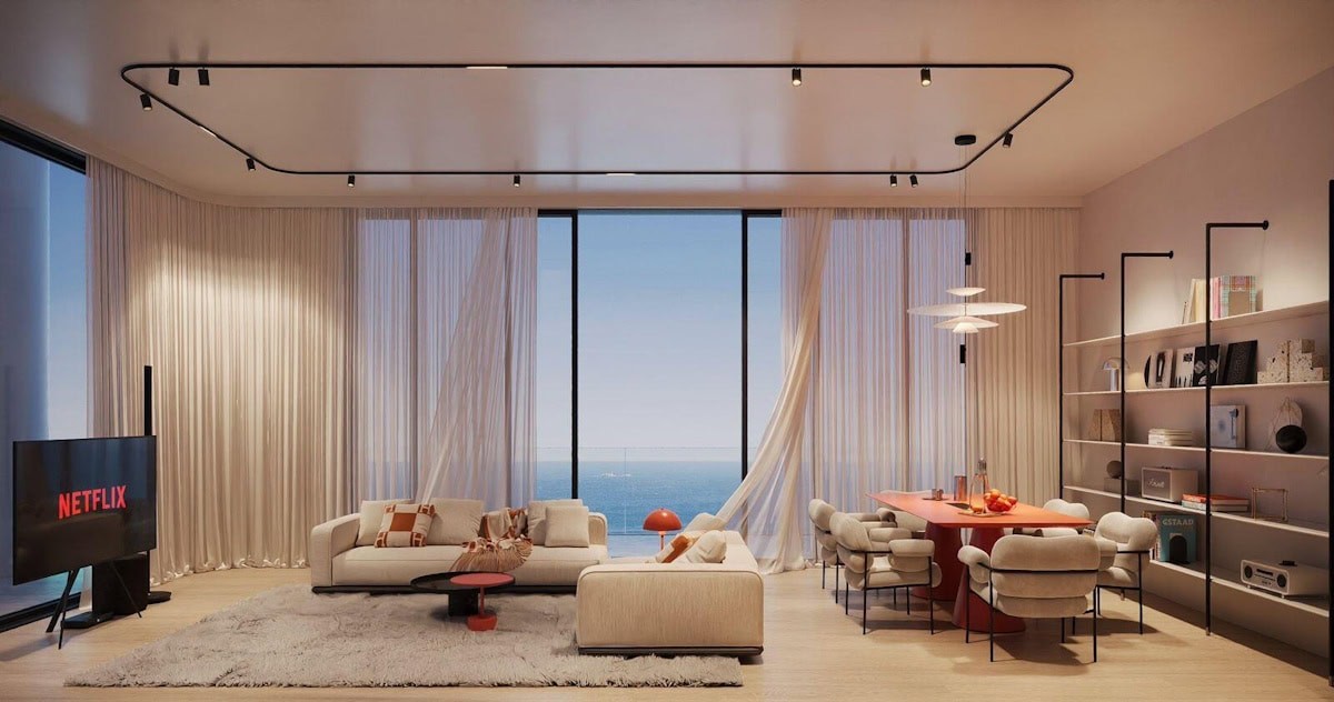 Modern living room adorned with white furniture and bold red accents, inspired by Villa del Arte design.