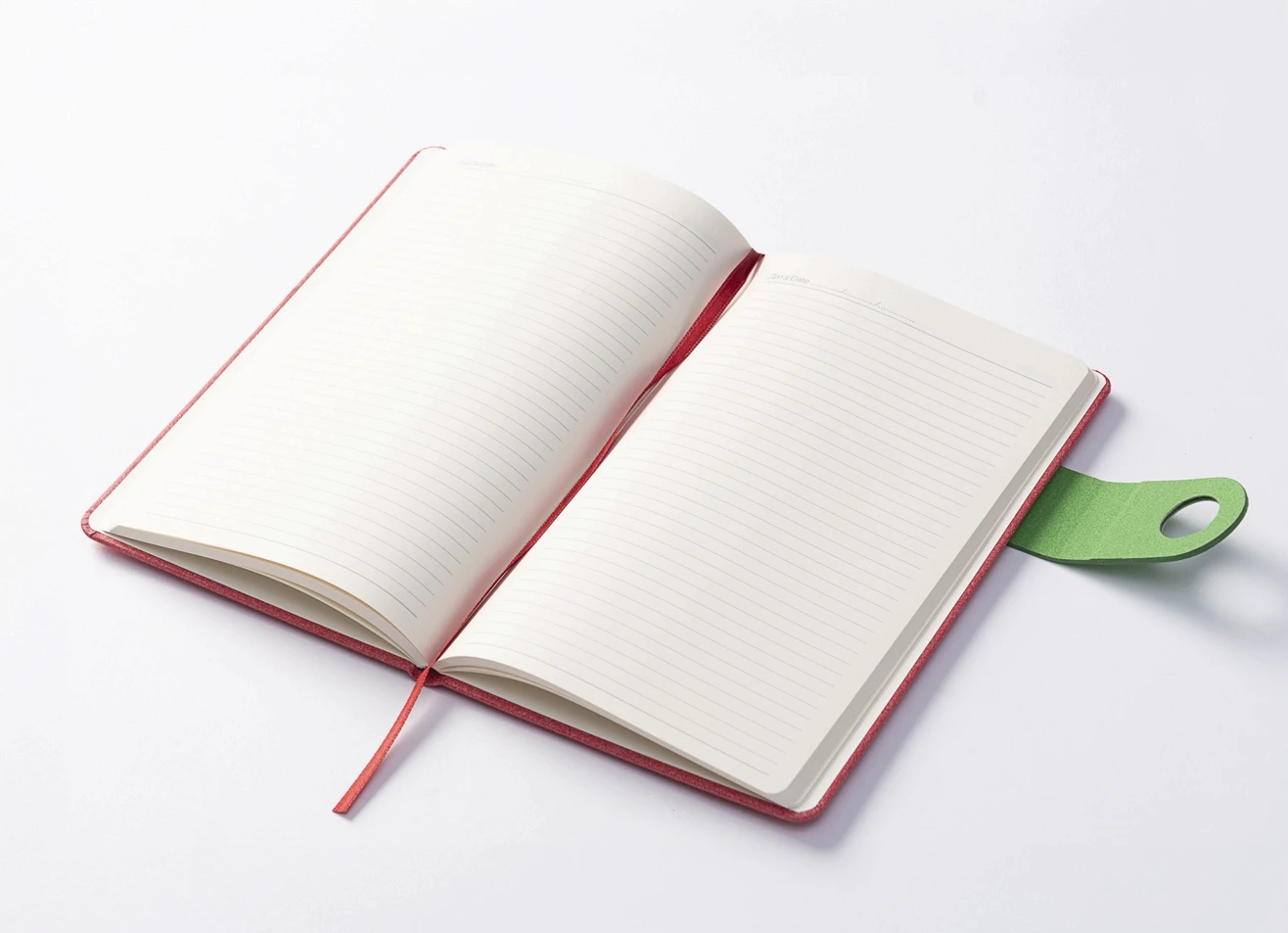 Open notebook with lined pages and green closure tab.