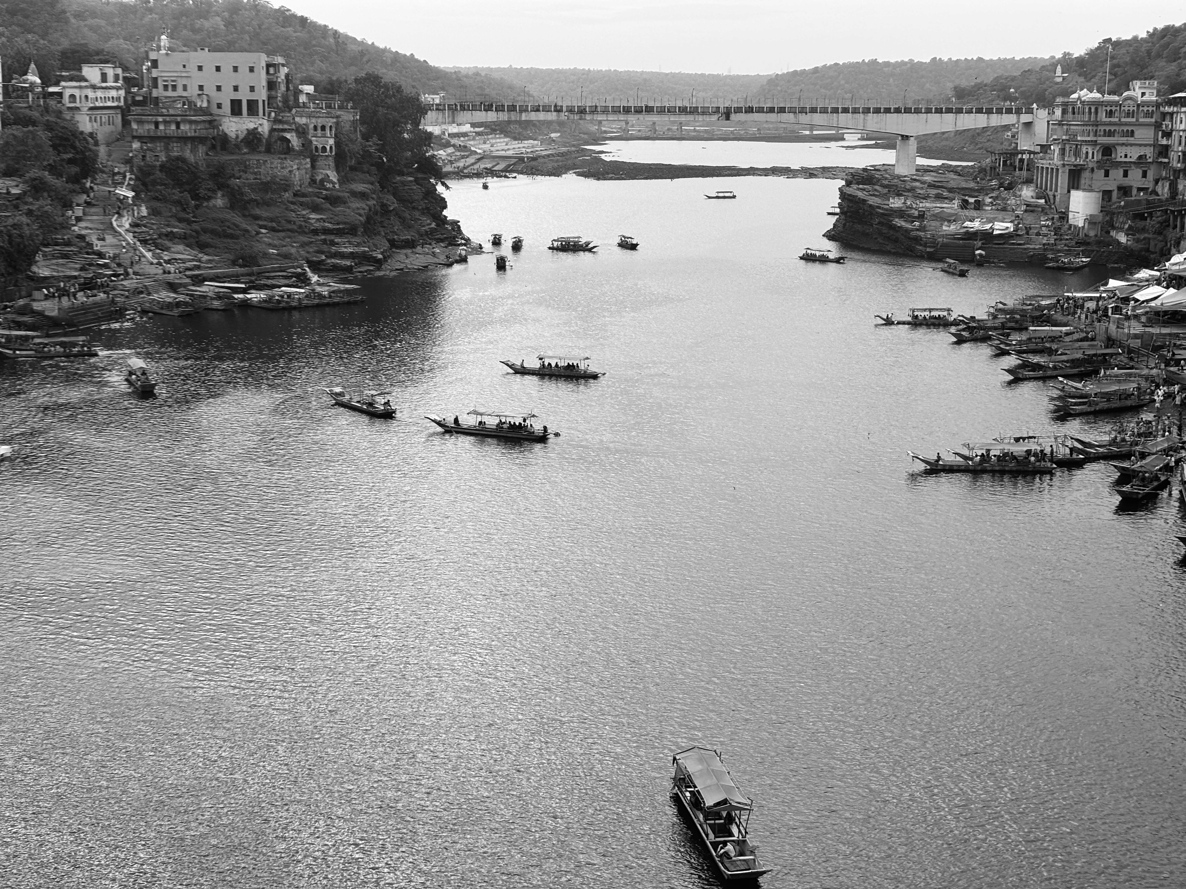 a group of people standing on top of a sandy beach