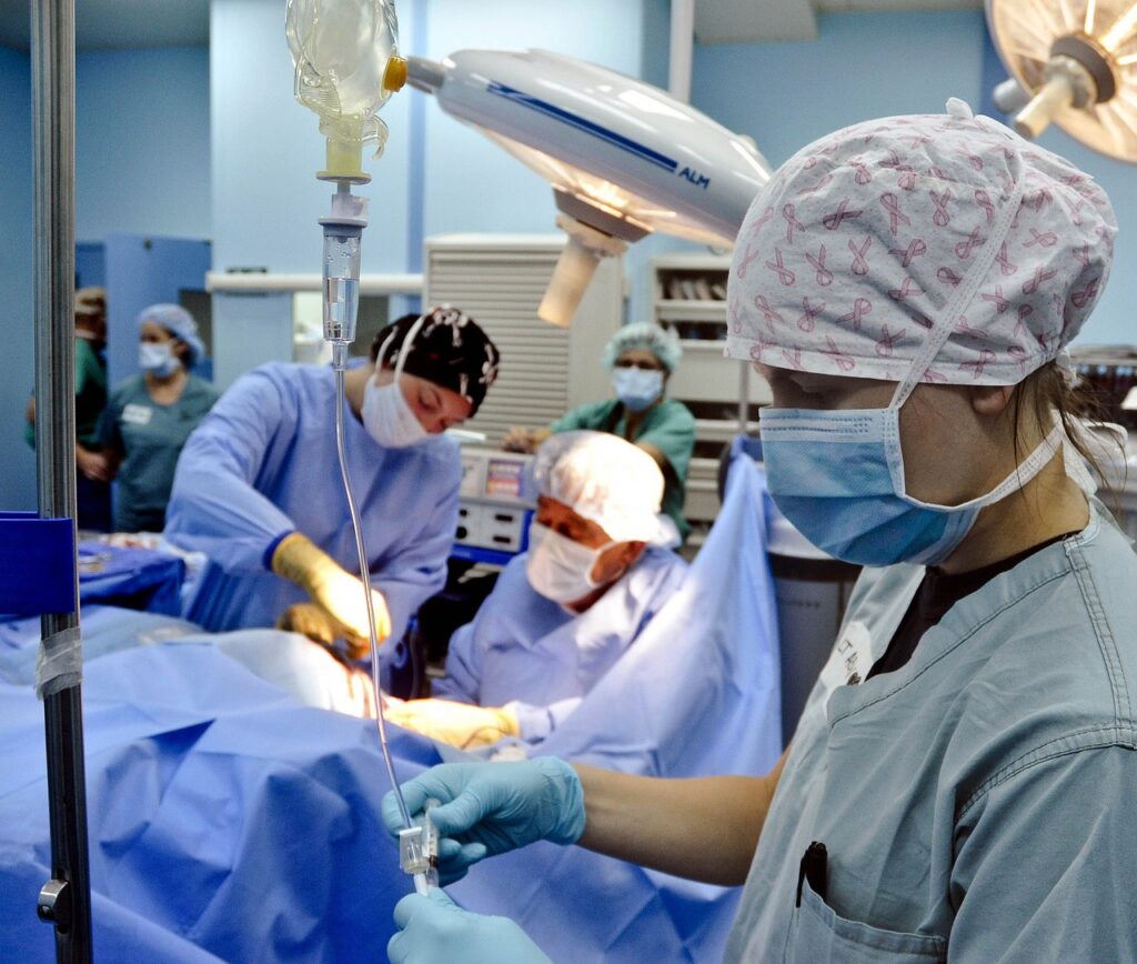 Surgical staff operating on a patient.