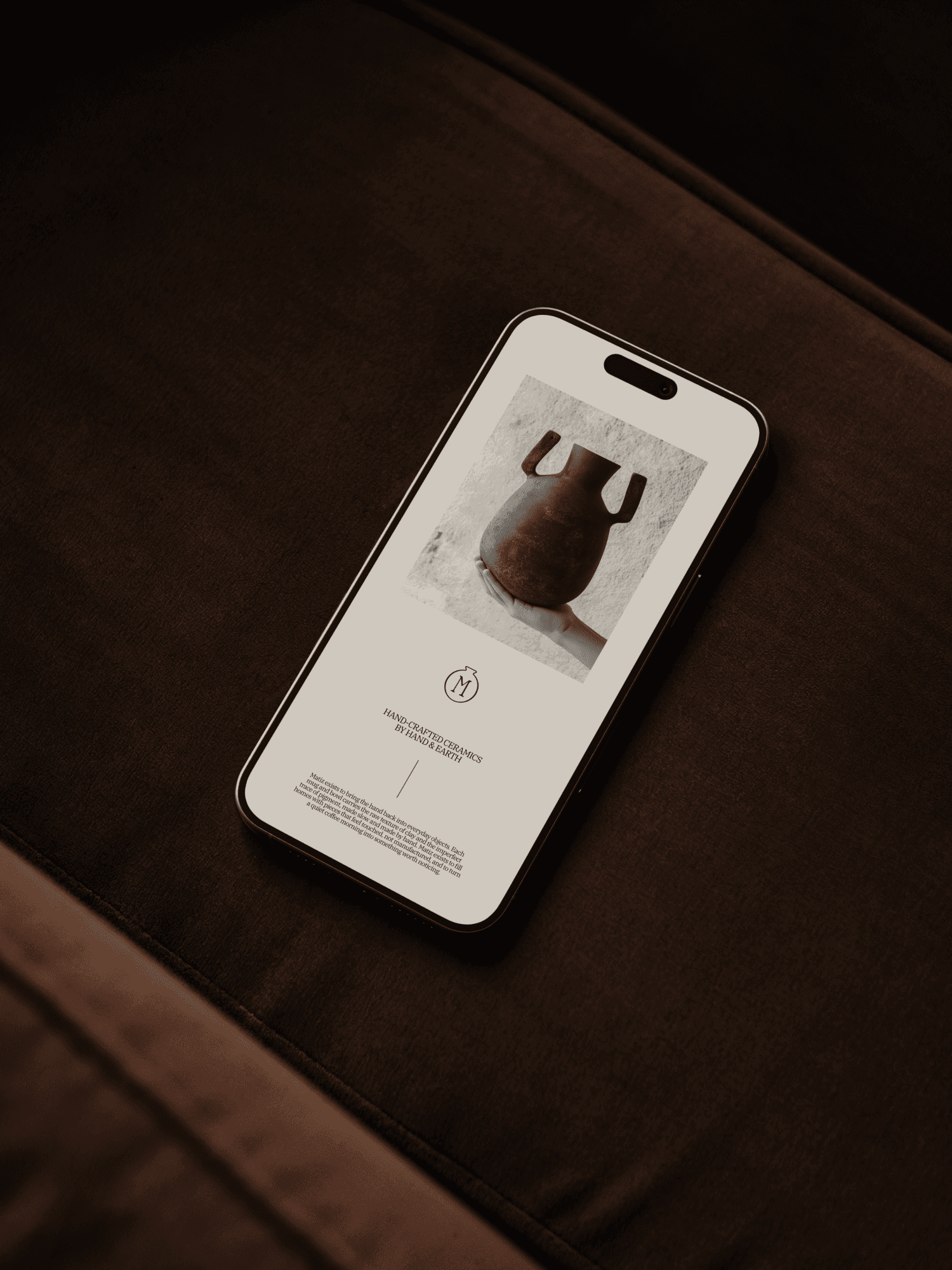 A cellphone with a photo of a ceramic pot and some text on the screen.
