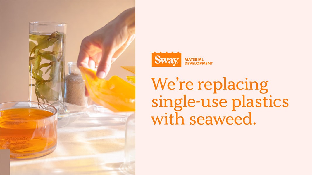 A hand holds a translucent yellow plastic bag over a glass containing seaweed and a glass of amber liquid. The background is light peach. The text on the right reads: “We’re replacing single-use plastics with seaweed.” A Sway Material Development logo is visible in the top right corner.