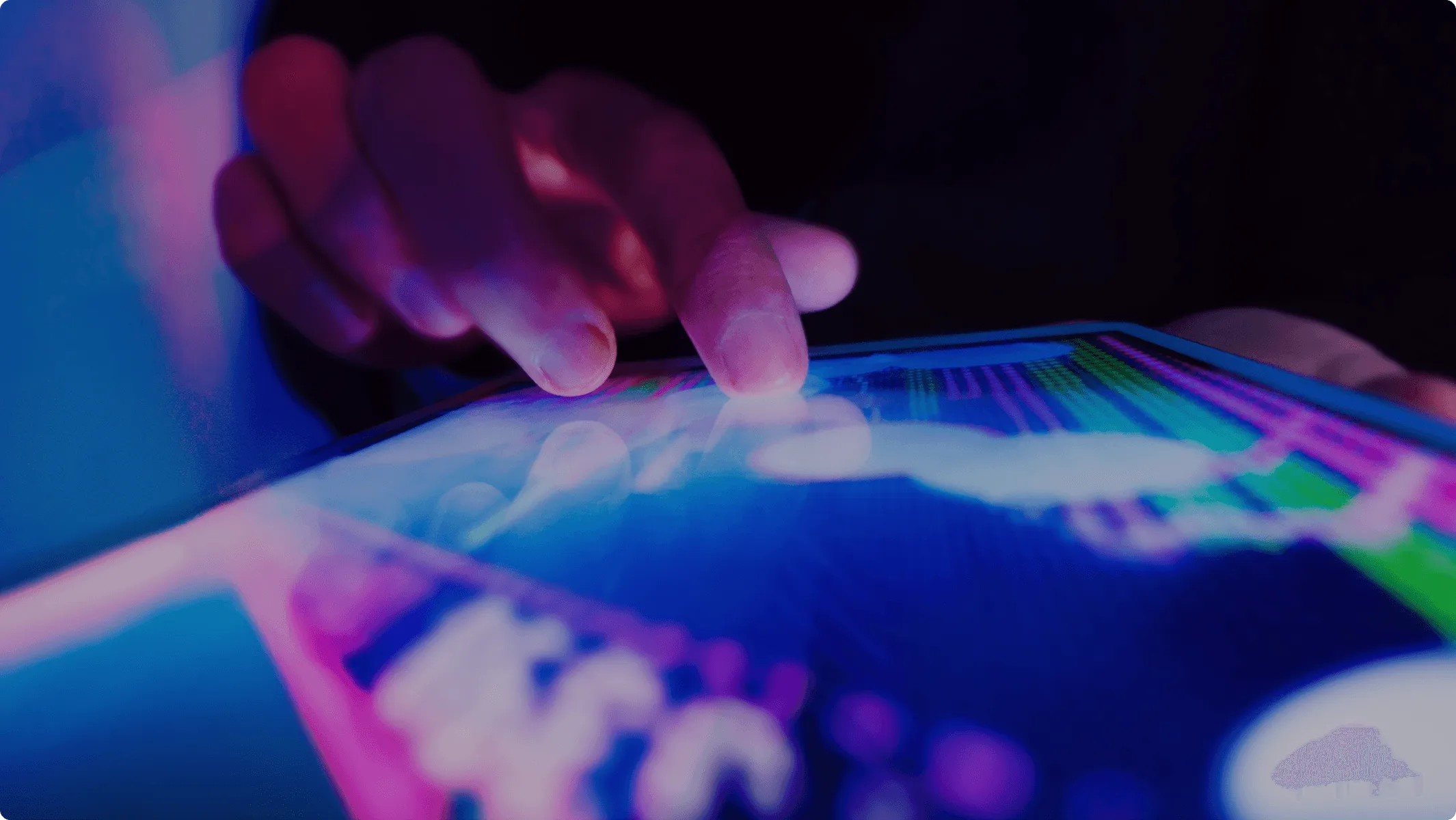Close up of fingers moving across a touch screen