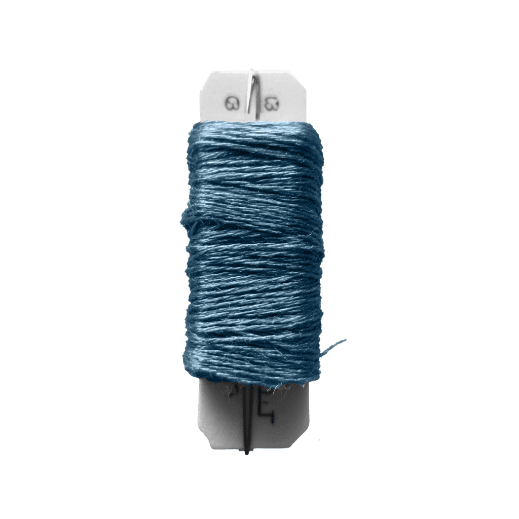 Blue thread spool. A craft item used for sewing, embroidery, or other textile arts. With a white plastic base.