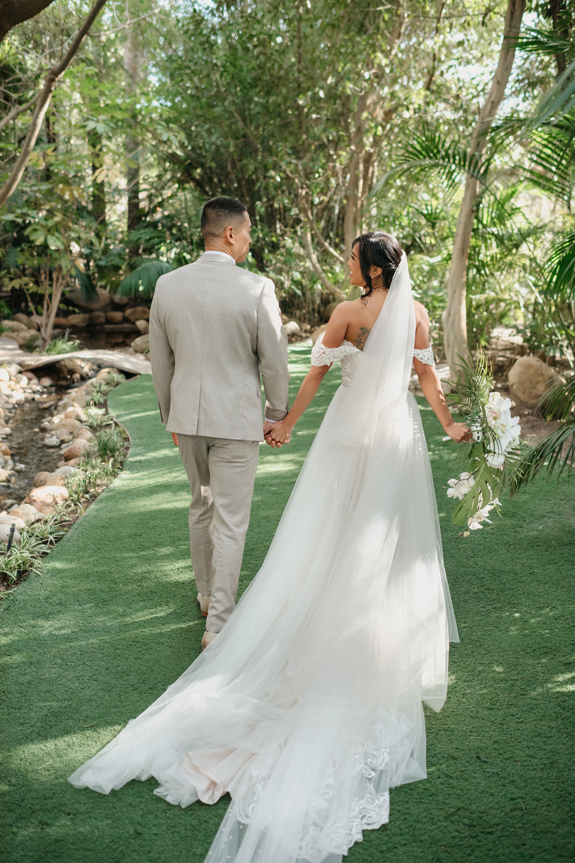 Flat lay wedding details with bouquet, rings, and sparkling bridal heels