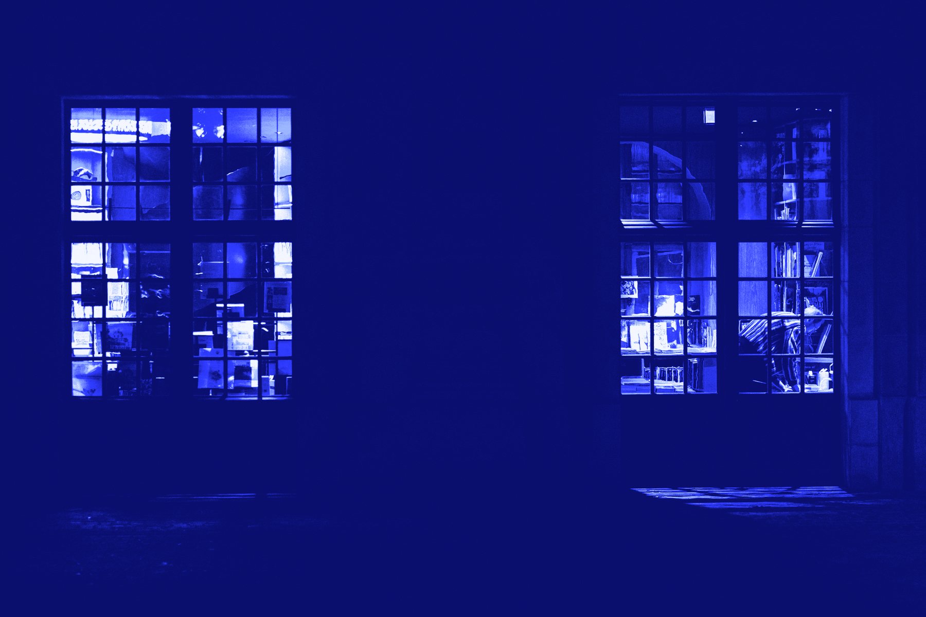 Lit windows in an apartment block at night