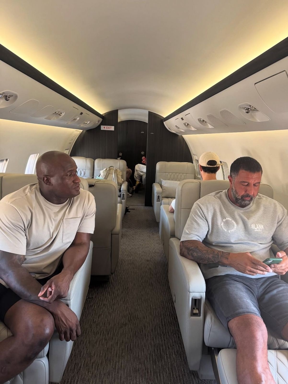 man standing beside wood planks