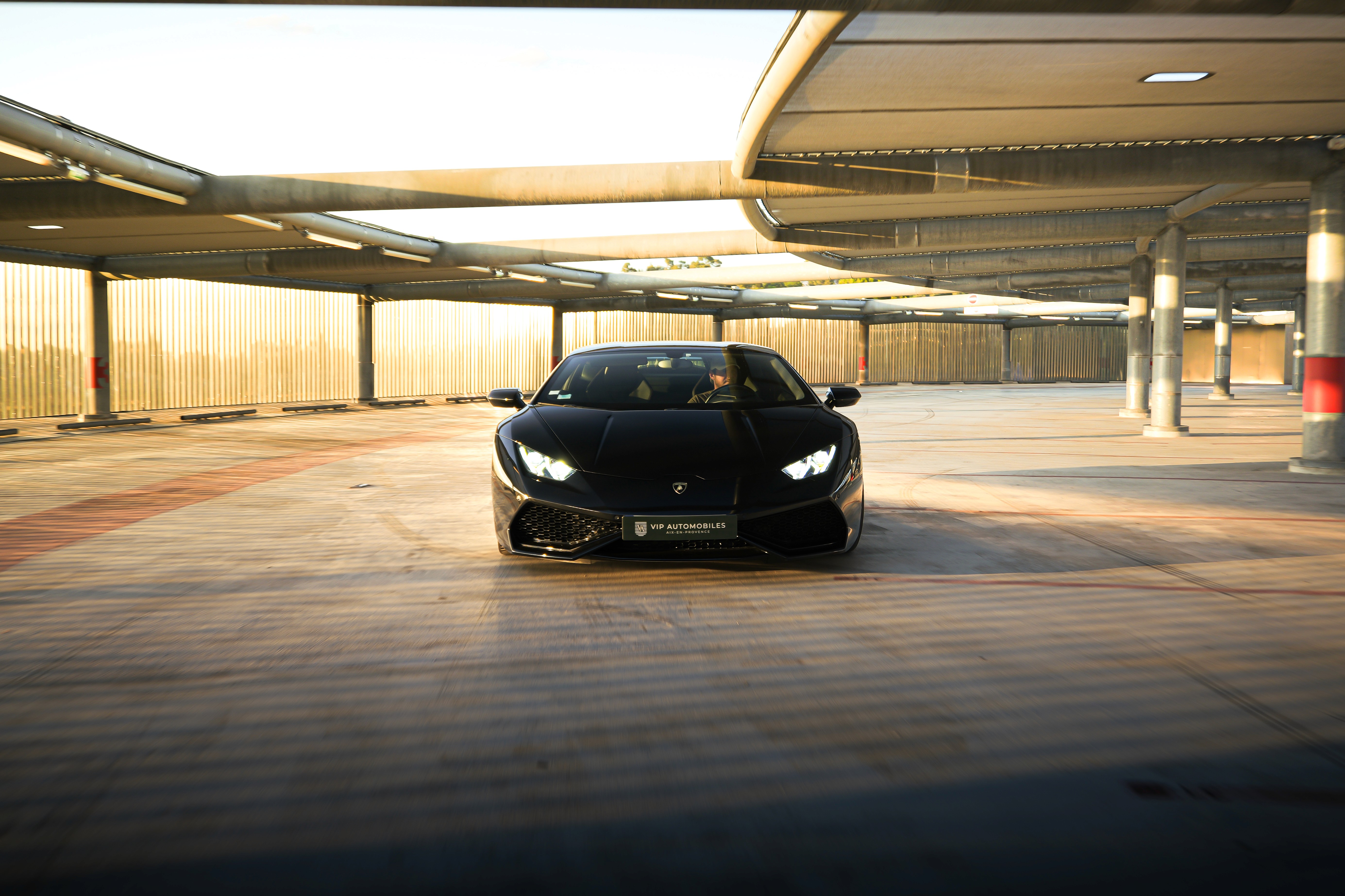 Black Car parked in the street.