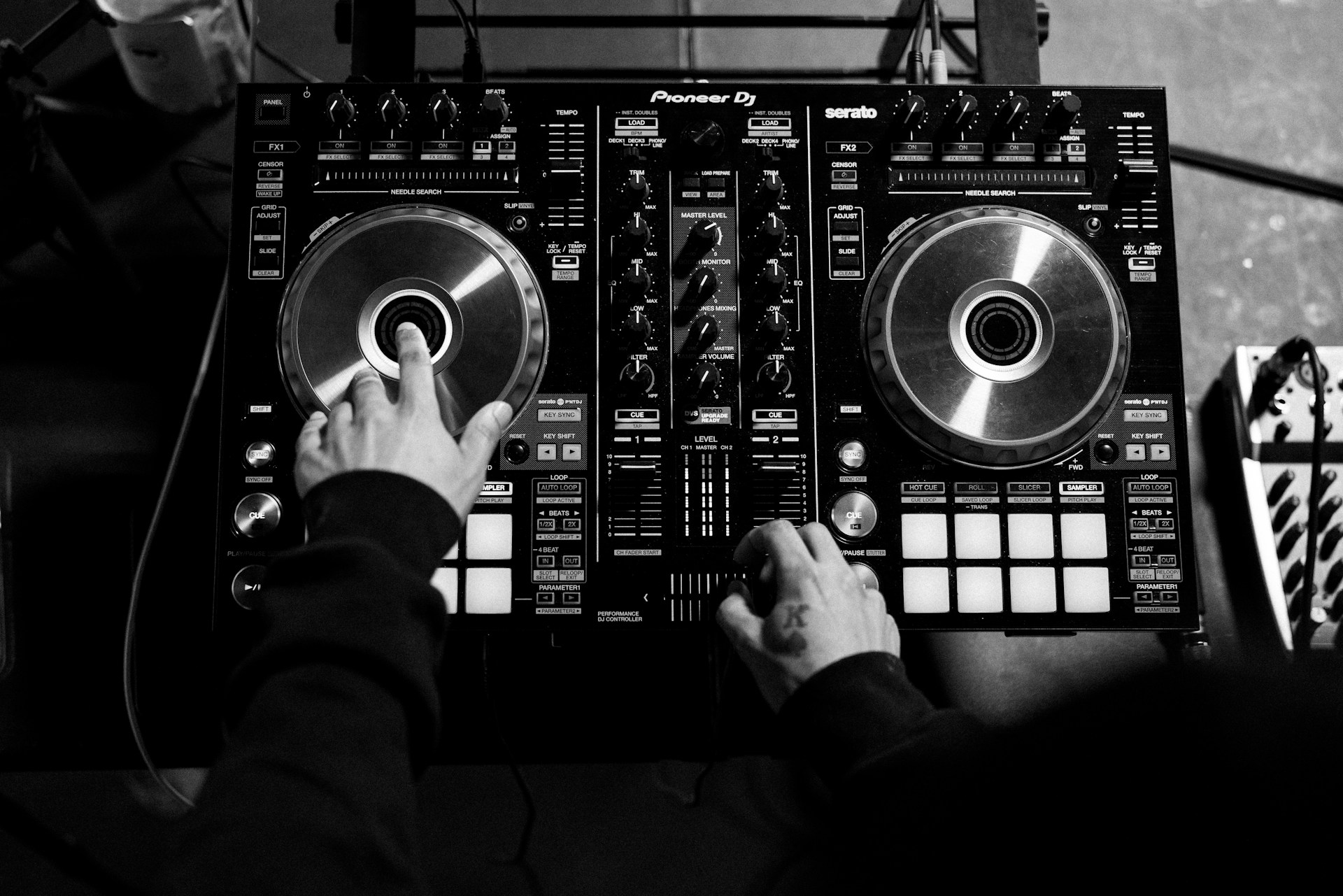 man with his equipment - What Is Deejaying in Hip Hop Music?