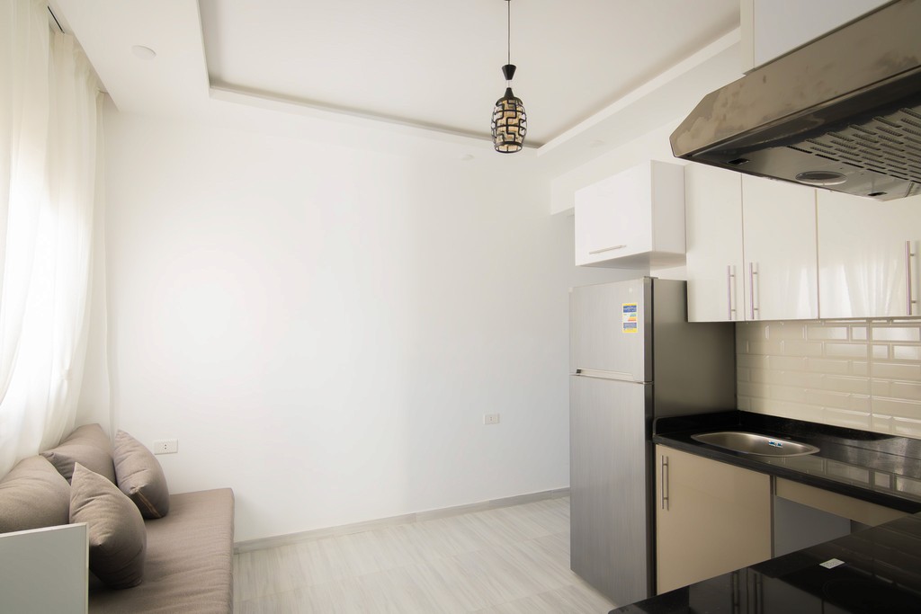 white and brown concrete building under blue sky during daytime