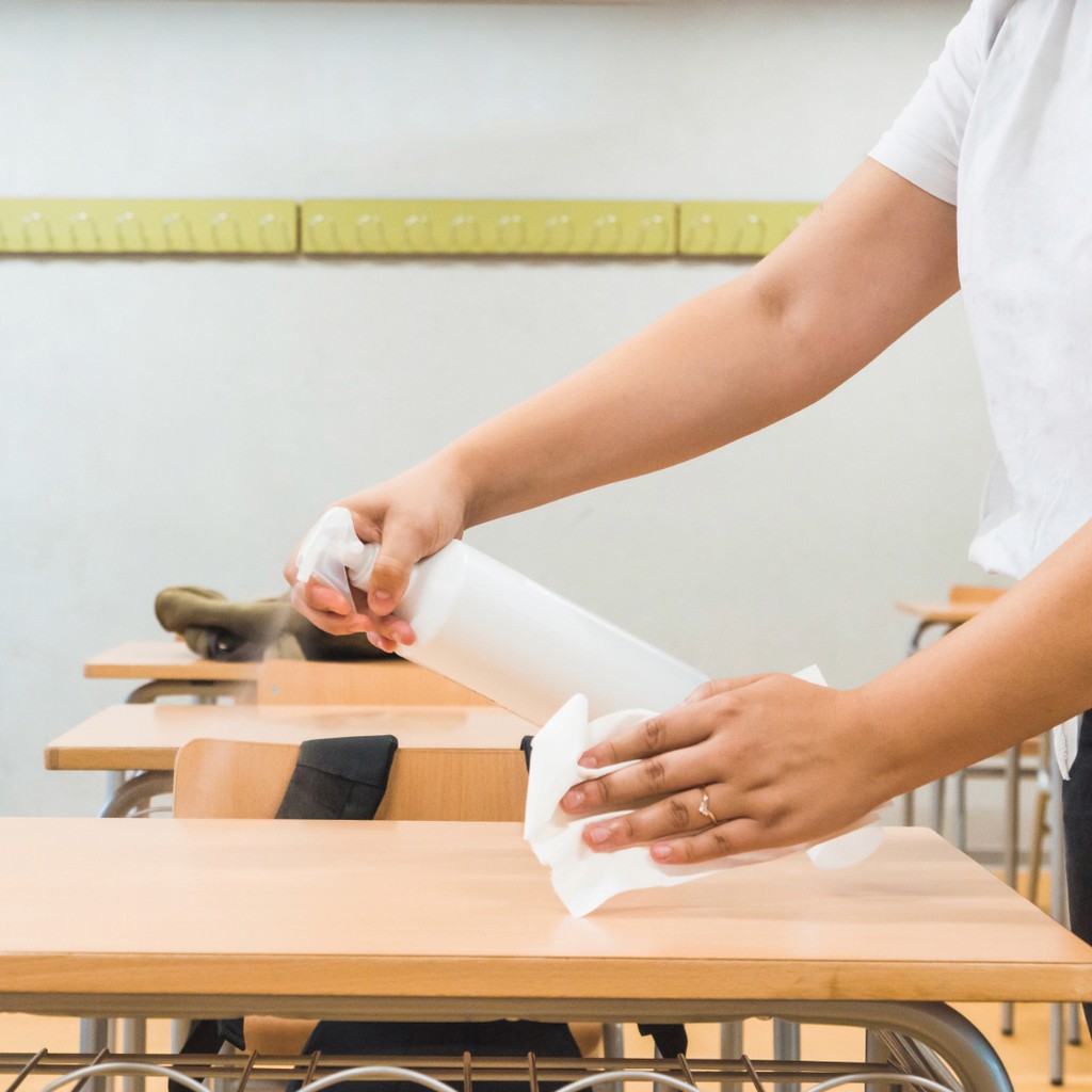 Cleaning classroom desk