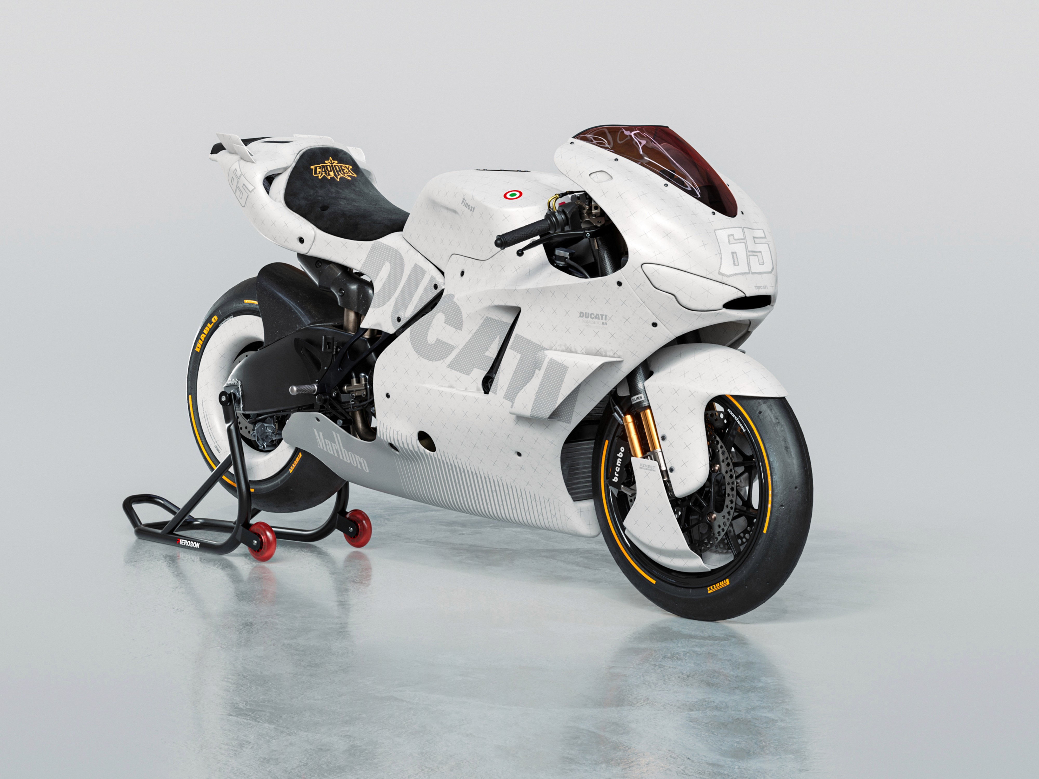 Vista tre quarti frontale di moto da corsa Ducati Desmosedici bianca su cavalletto nero Pierobon.