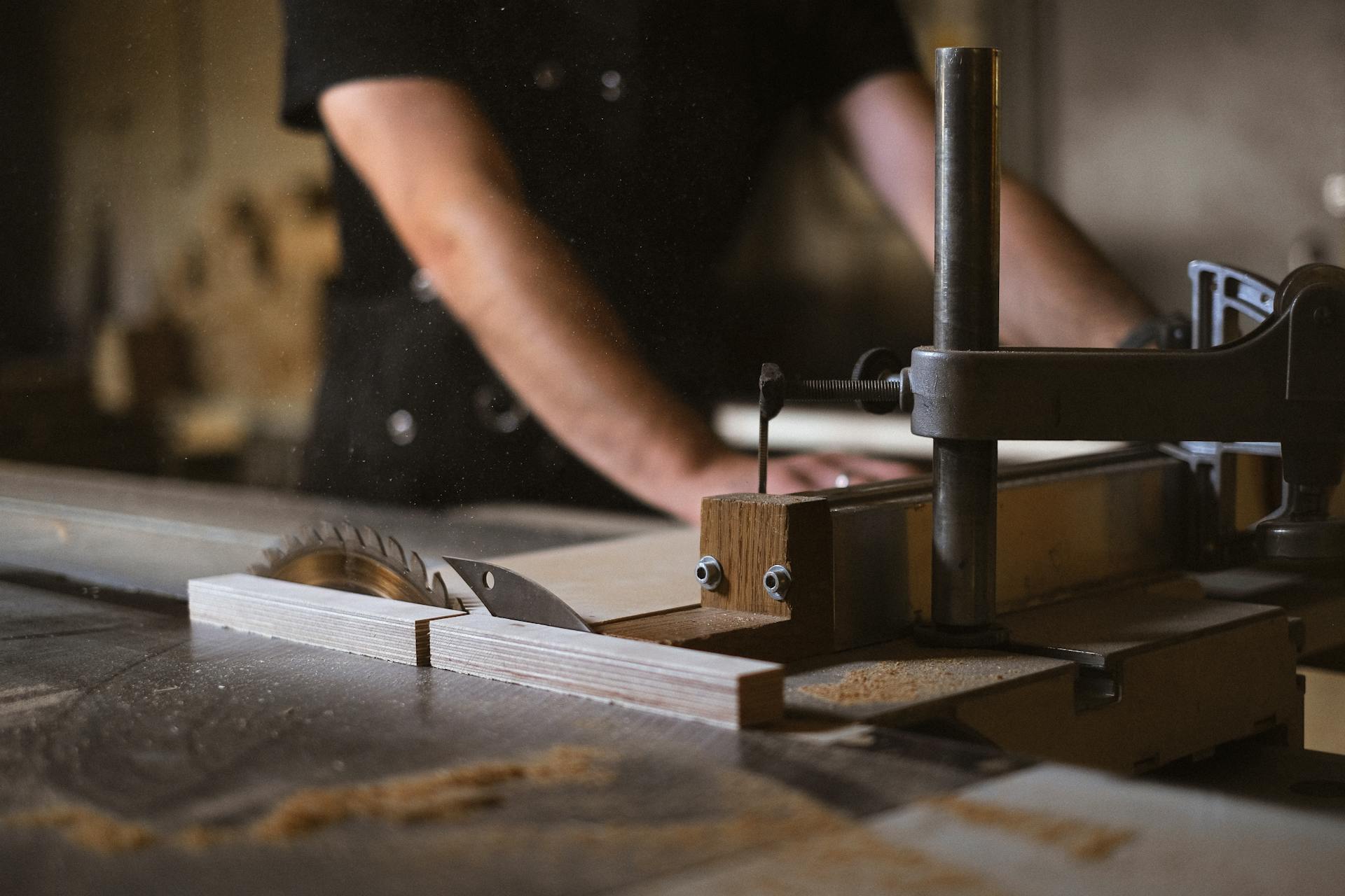 Precision wood cutting on table saw for custom deck construction in Ottawa