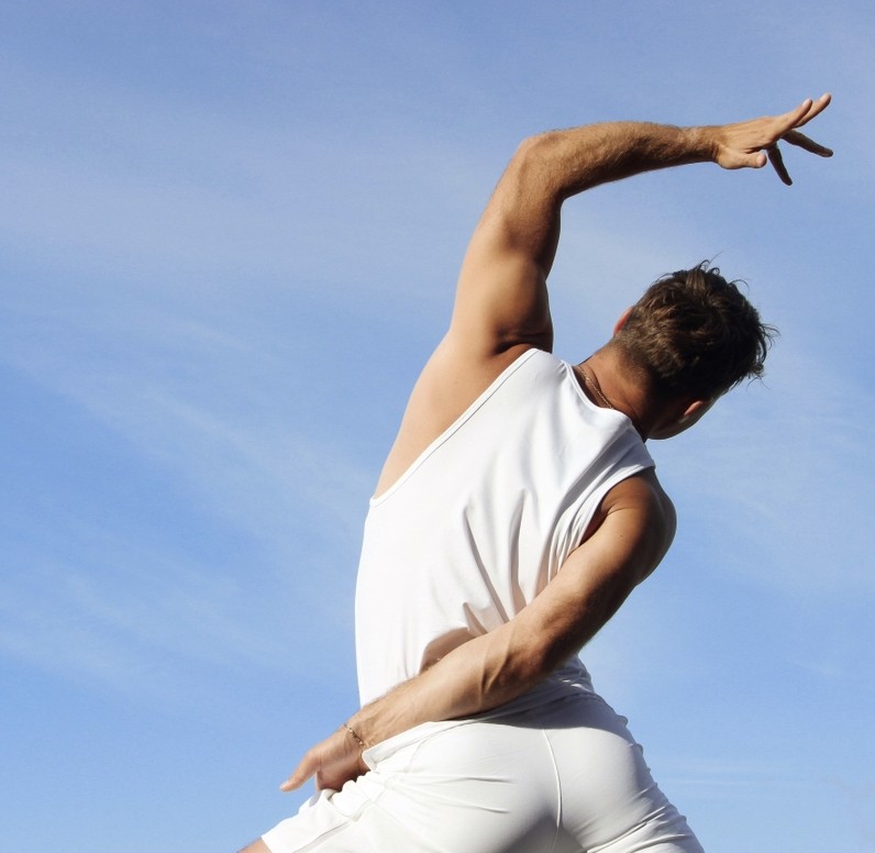 Black cosmetic product bottle against a dark background