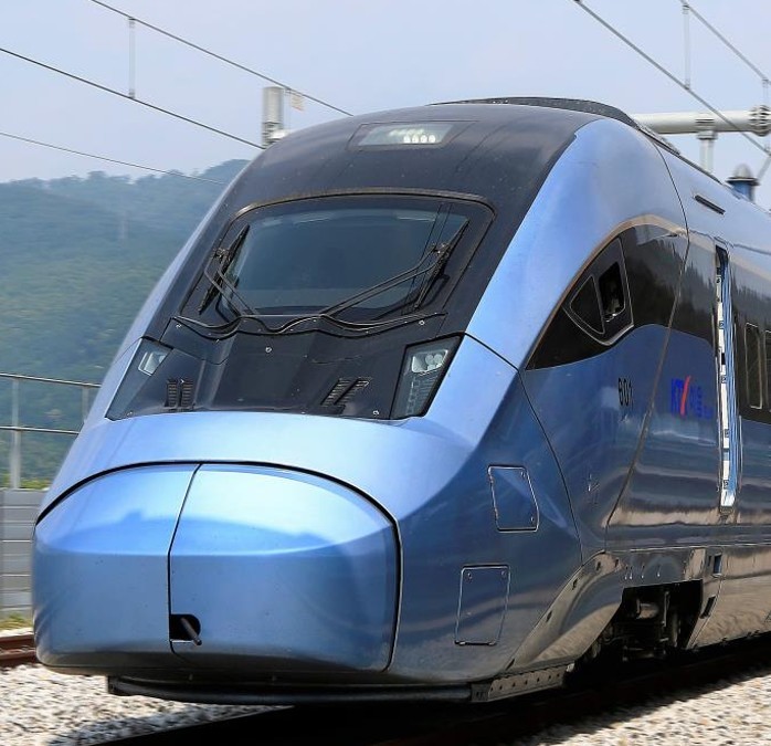 A brown, textured canvas coffee bag with a leather strap and buckle on a warm, earthy background. The label reads "SFFEES COFFEE." Rustic and inviting