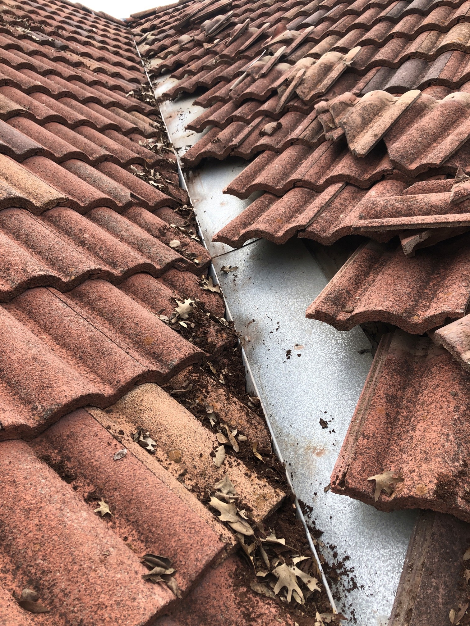 Tile roof repair, leaking valley. 