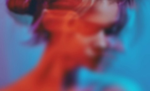 Abstract blurred portrait with red and blue neon lighting