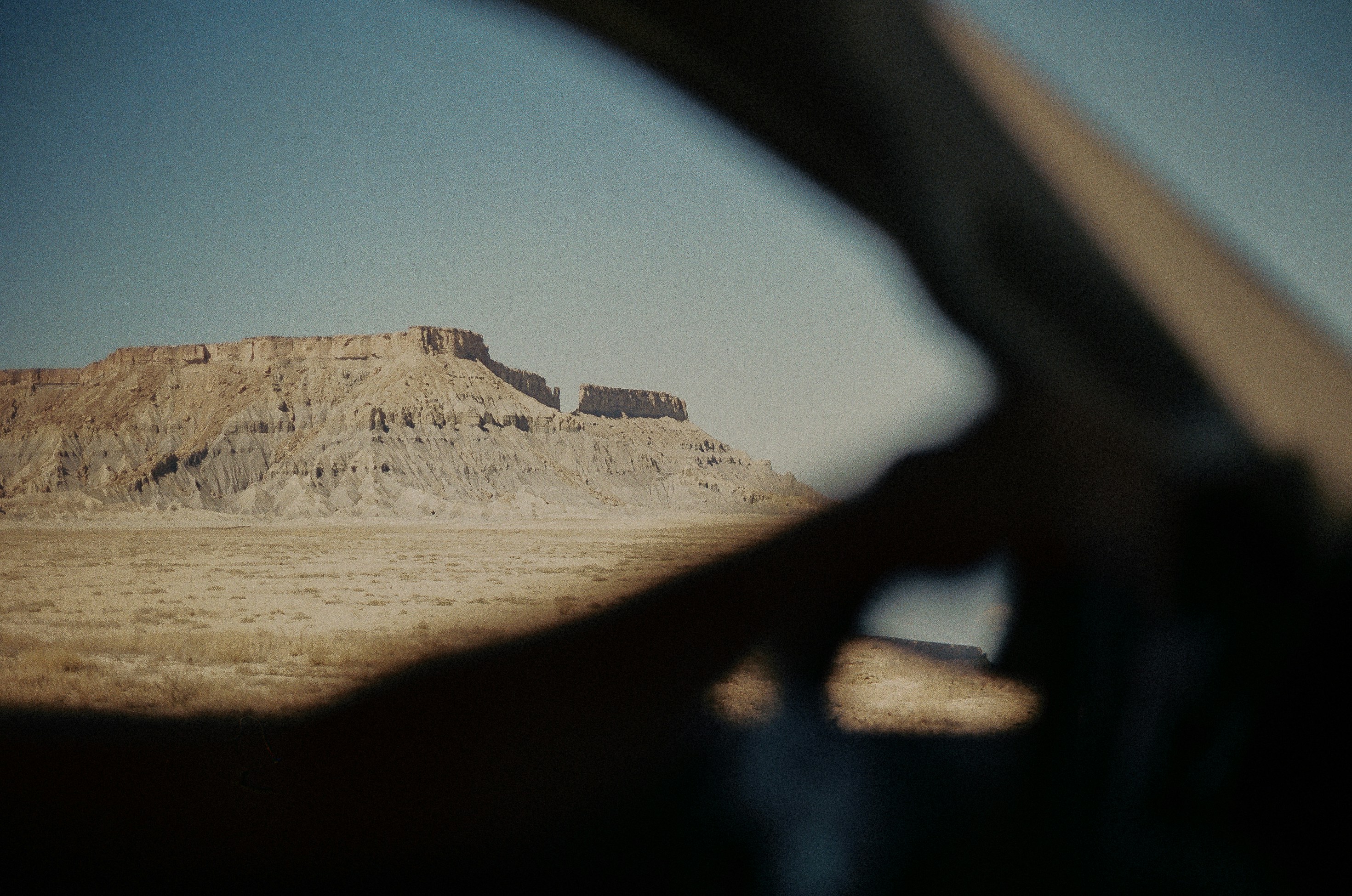 Desert landscape viewed through a car windshield