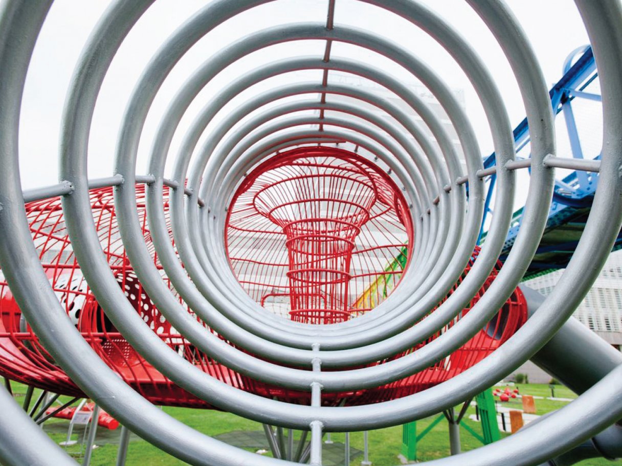 Rooftops of a coastal town with the sea in background