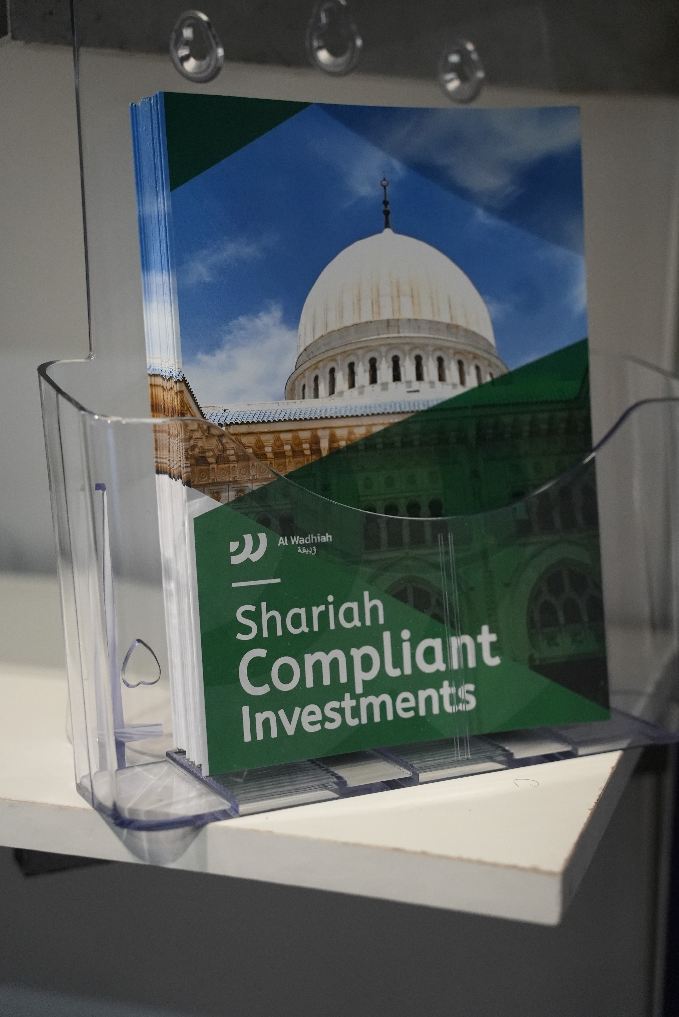 two people looking at a tablet and smiling