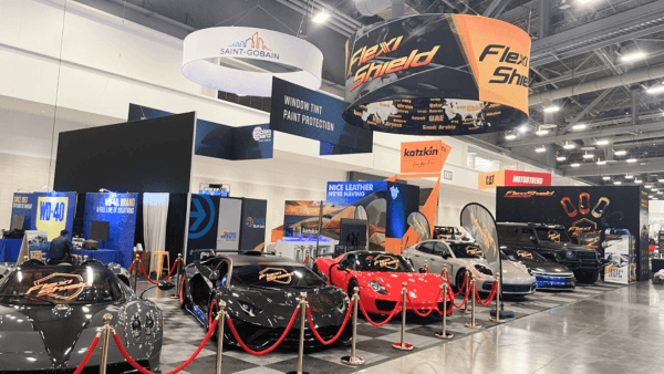 A larger SEMA exhibit environment shaped around display scale, visitor movement, and stronger visual impact in a high-traffic automotive setting.