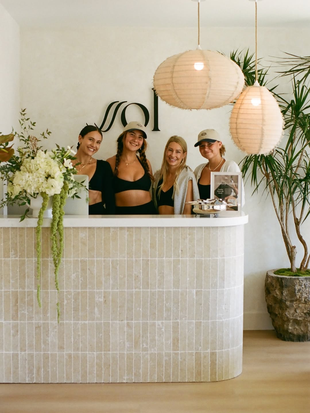 Ssol Pilates studio reception showing staff standing behind front desk