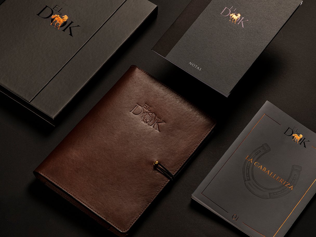 Rustic cabin in a golden field at sunset