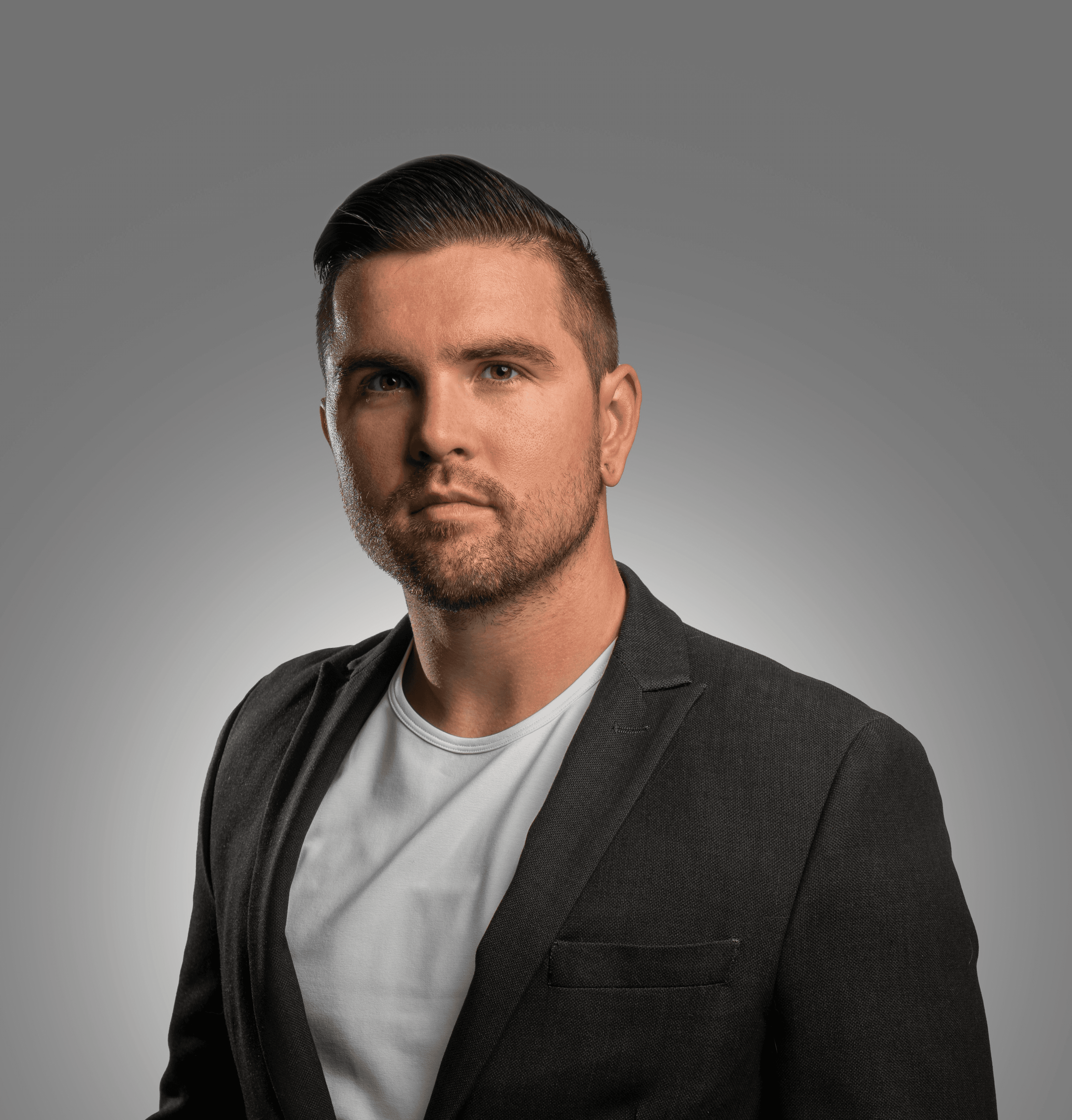 a man in a suit posing for a picture
