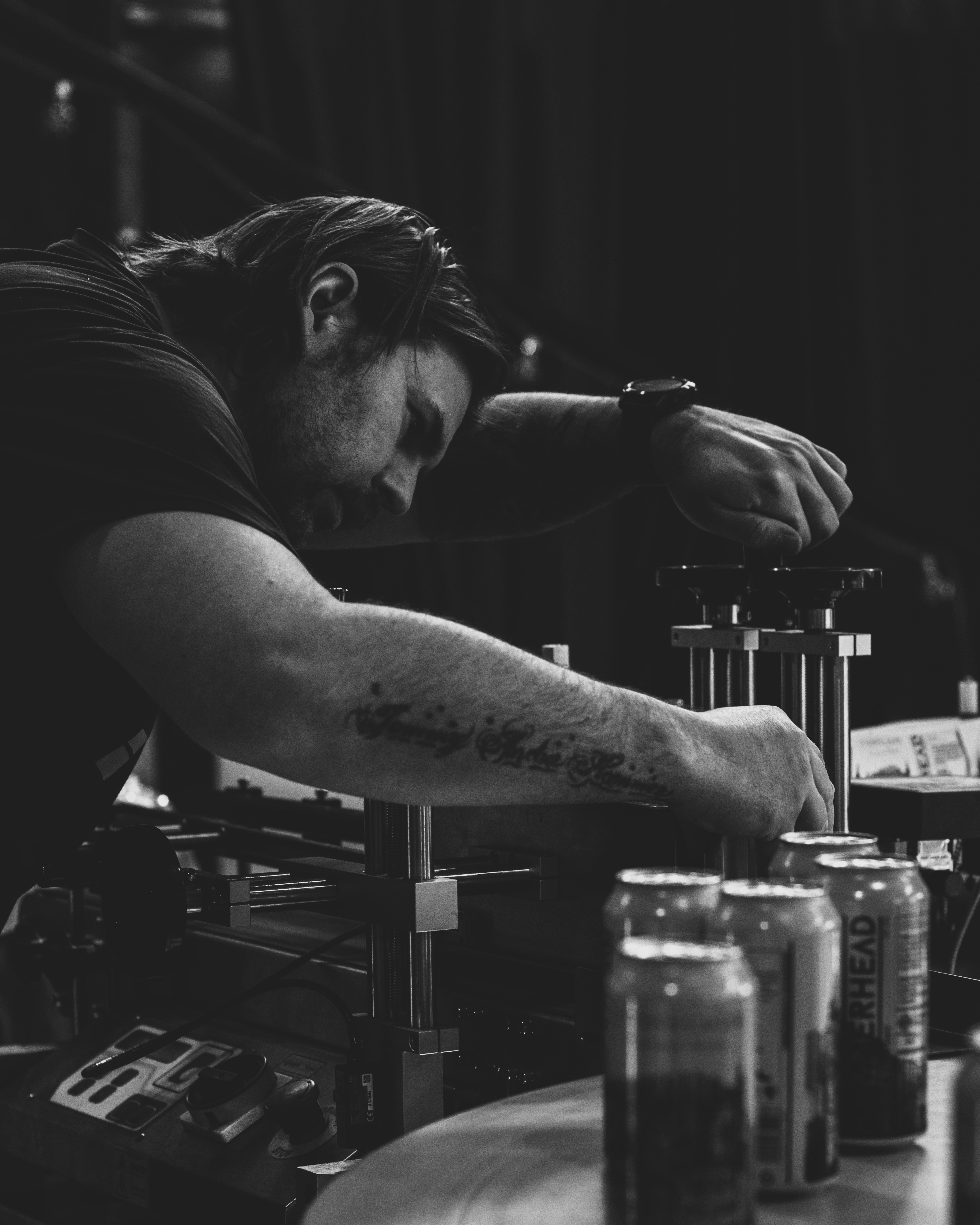 Two people talking at table in plant-filled café
