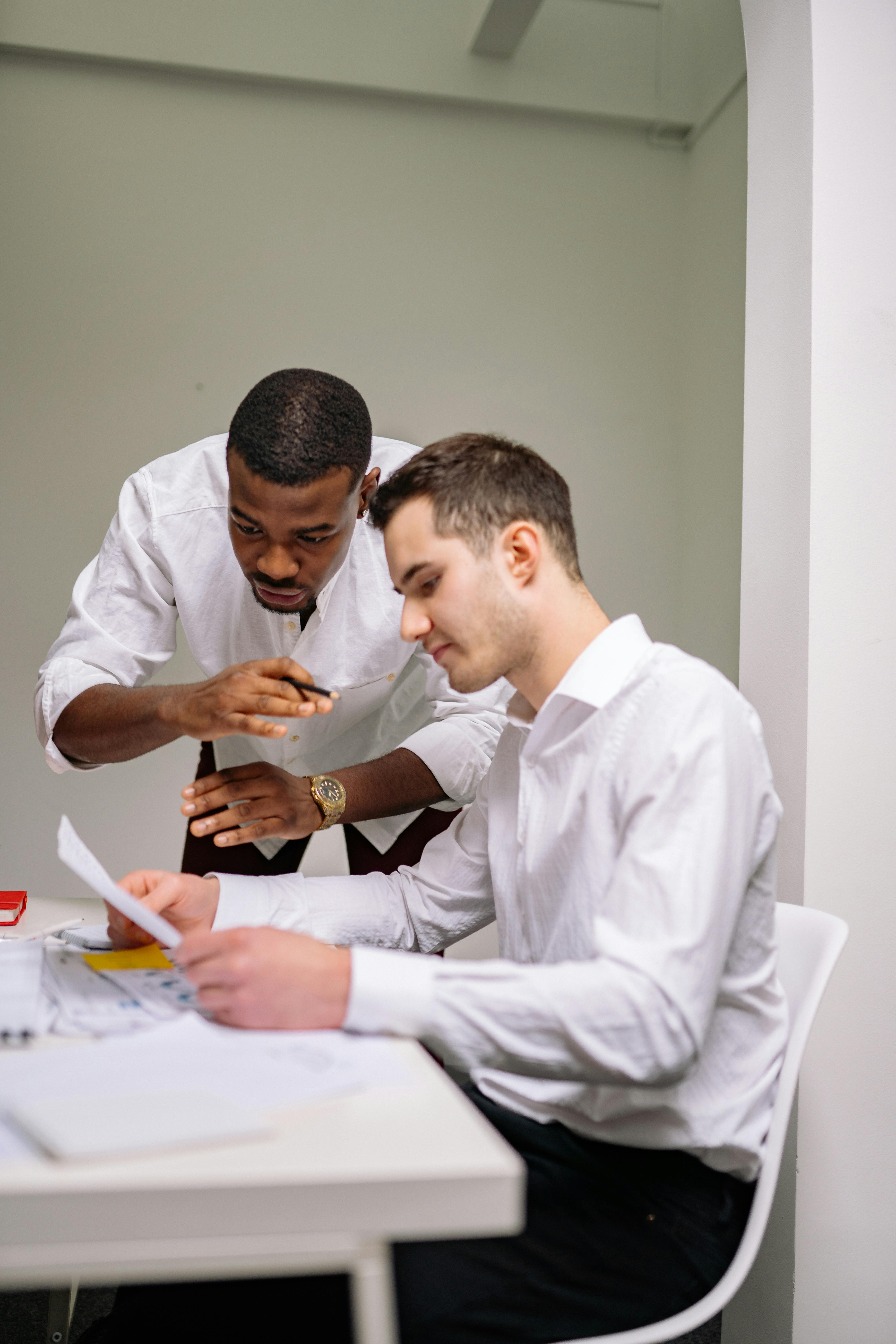 Two psychologists collaborating during a reflective supervision and professional development session