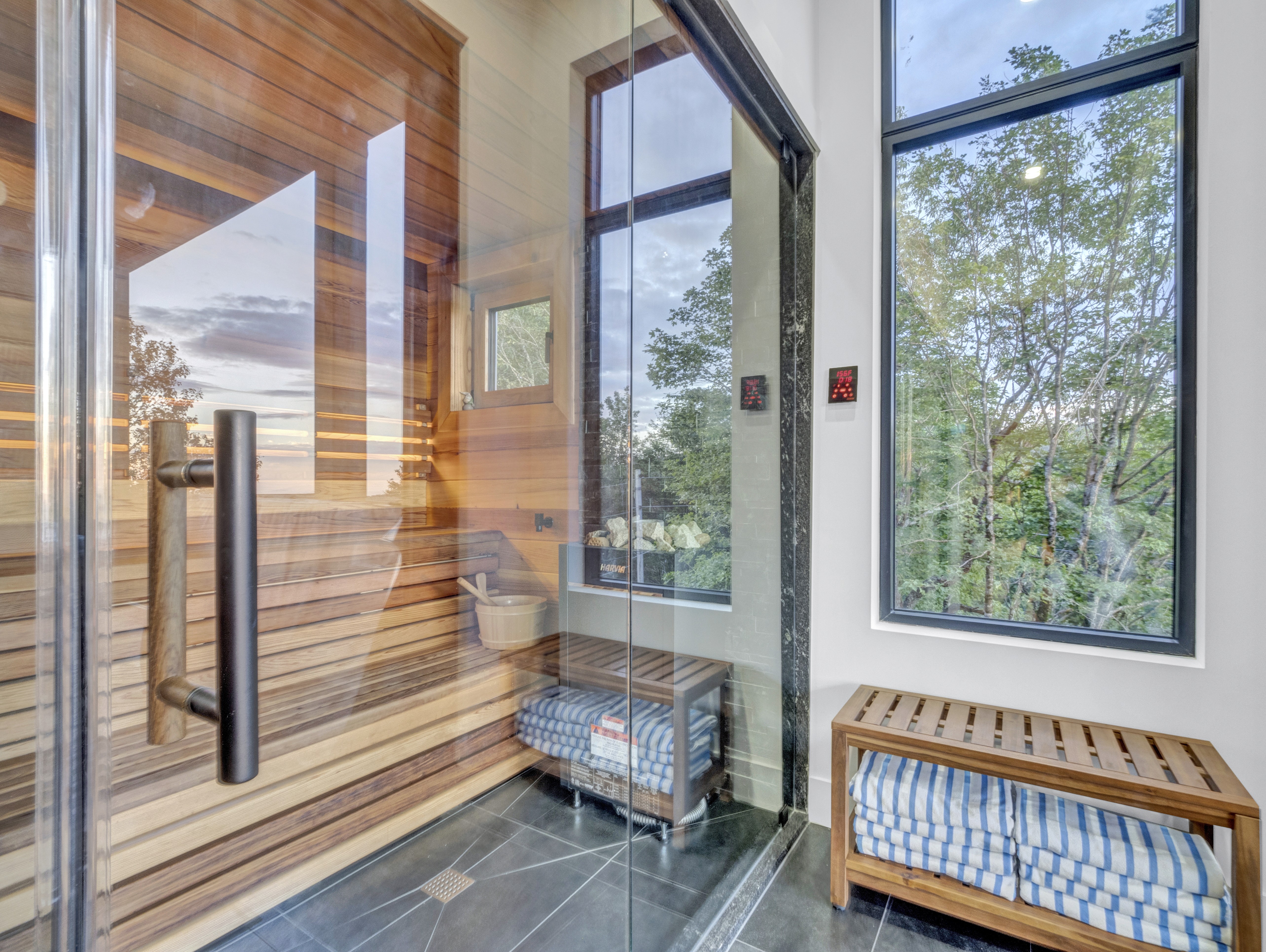 close up view of finnish sauna and glass doors mountain views