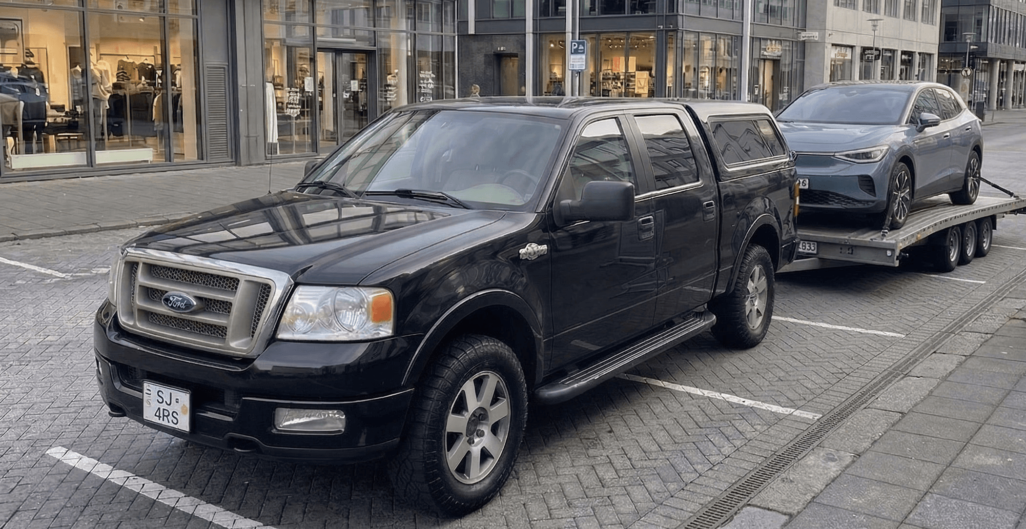 a garage filled with lots of different colored cars