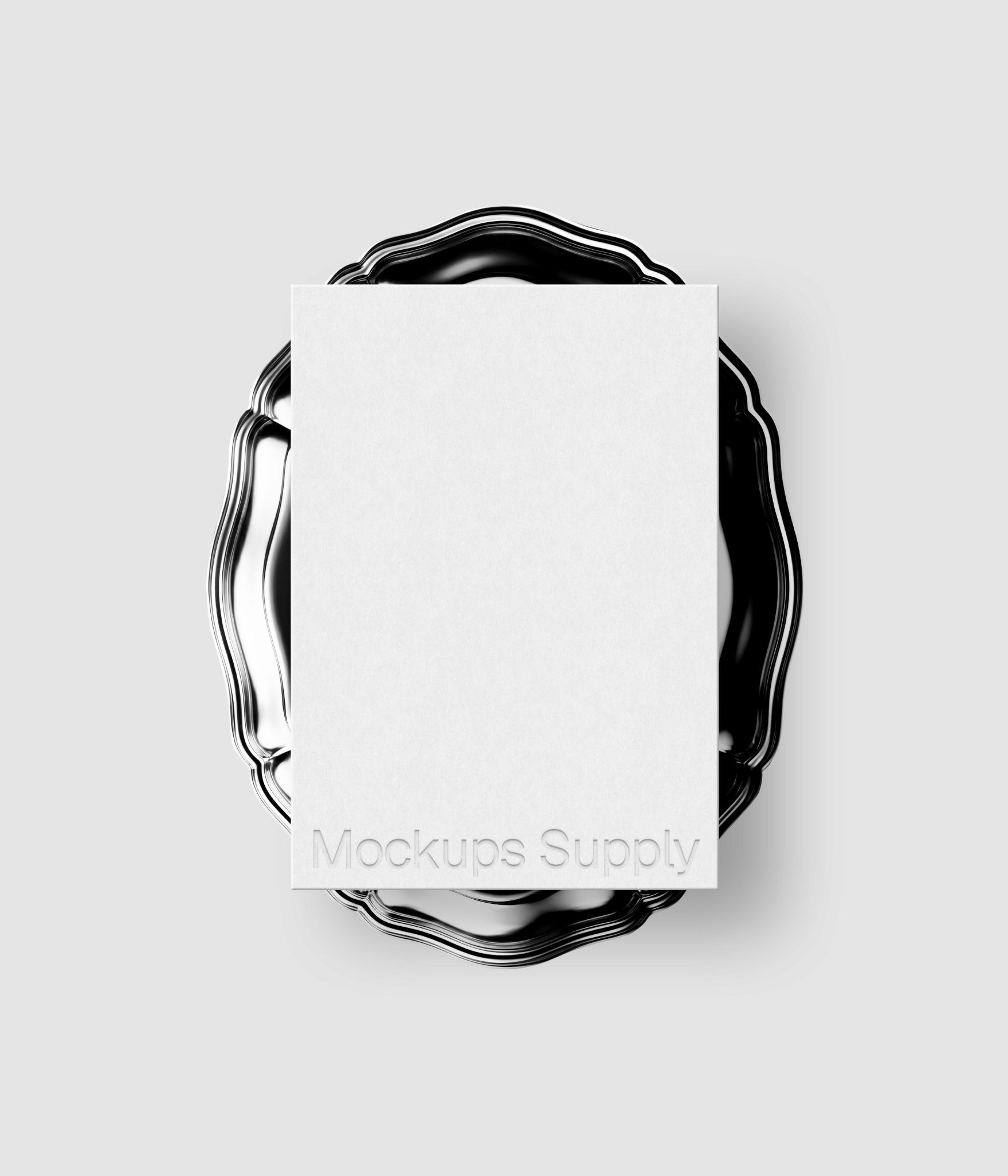 Paper mockup with embossed logo detail on antique silver plate for identity design and portfolio showcase download on Mockups Supply