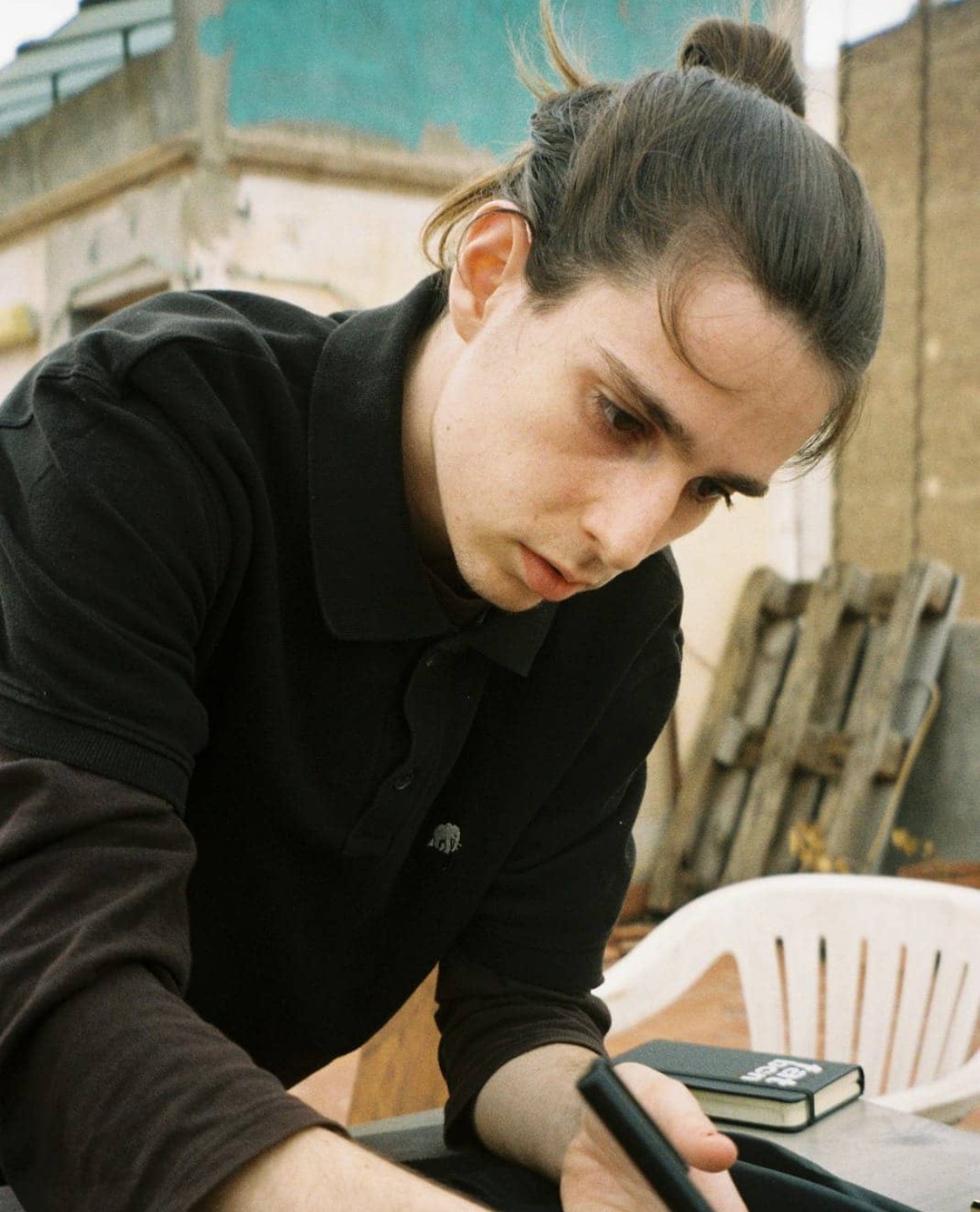 Portrait of medium black and white dog on red background