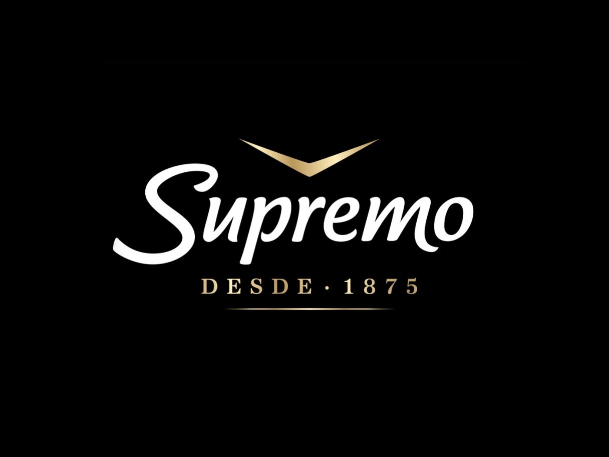 Rustic cabin in a golden field at sunset