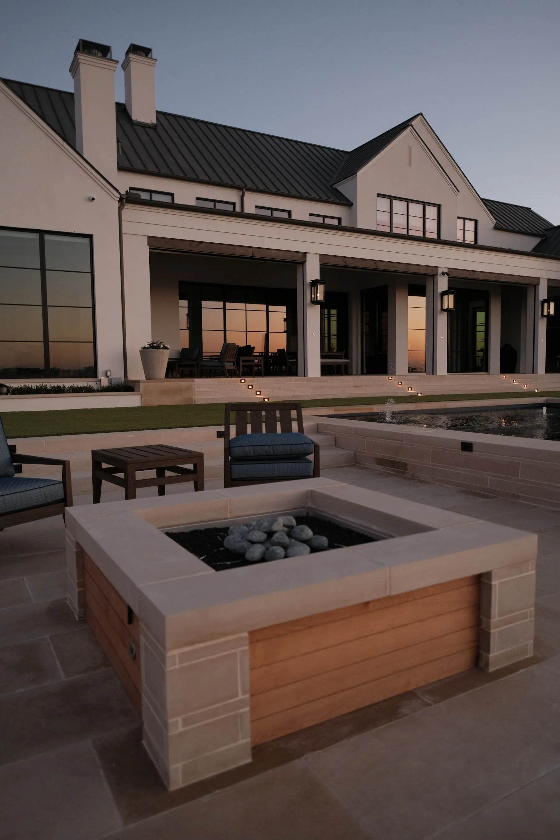 Custom fire feature and pool at golden hour, Blount Designs Frisco TX
