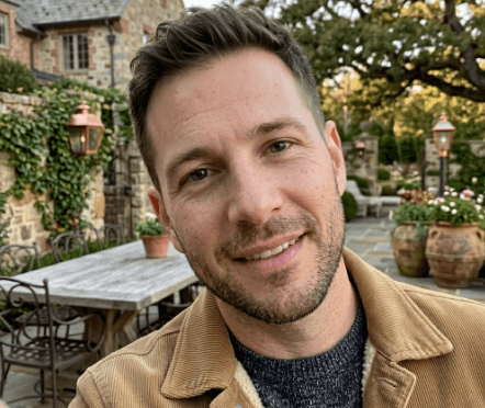 A person in a blue coat smiling