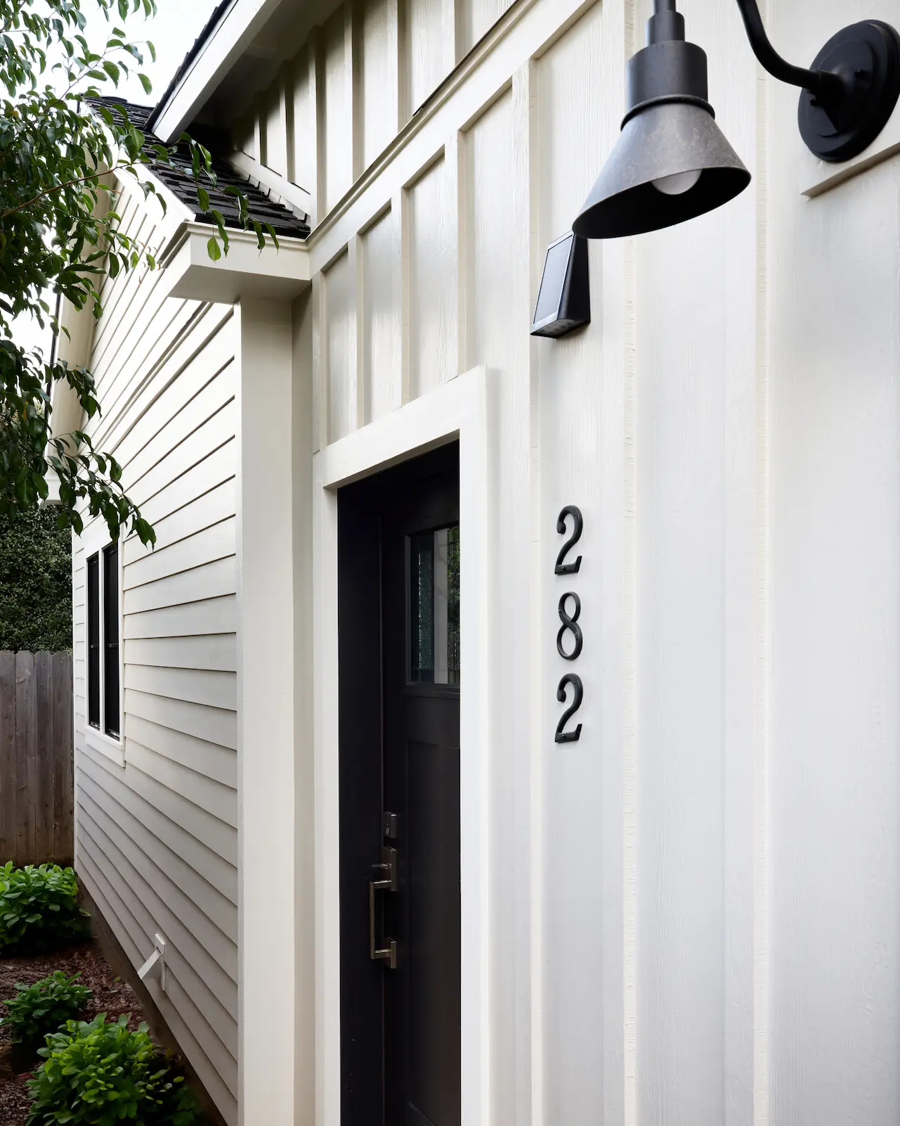 Portrait of the ADU's front entry, a testament to the Craftsman style with modern touches, reflecting Orange's historical roots. Photo by Todd Huge.