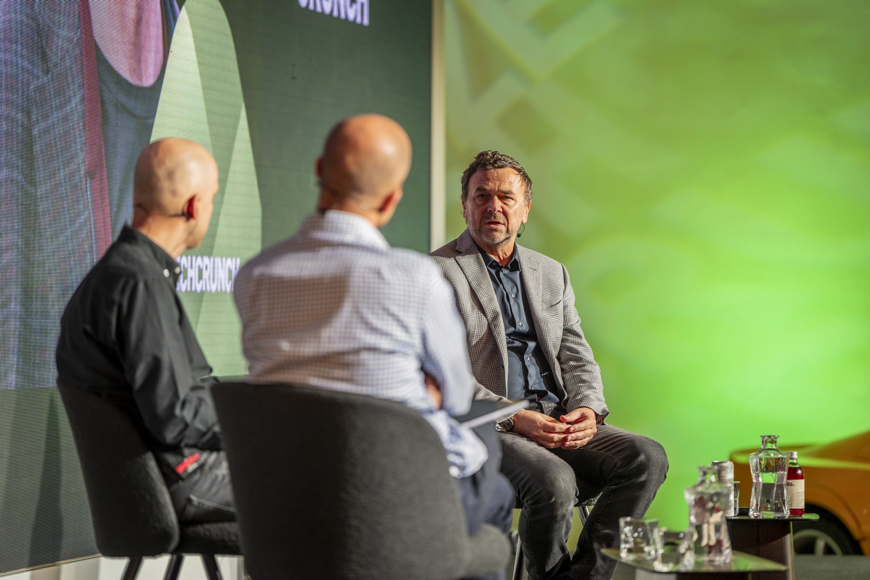 Interview-style discussion with a guest speaker during a business conference session.