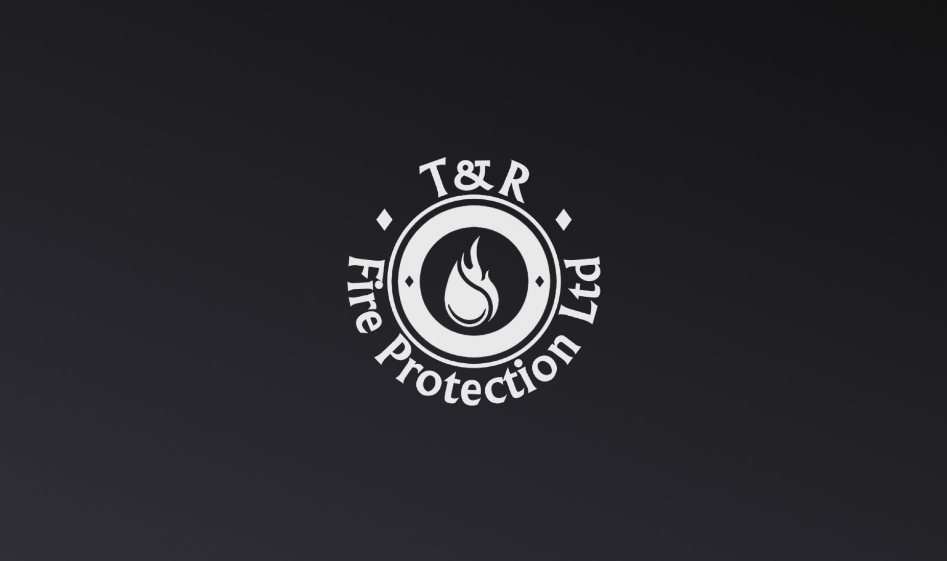 T&R Fire Protection Logo on a dark background