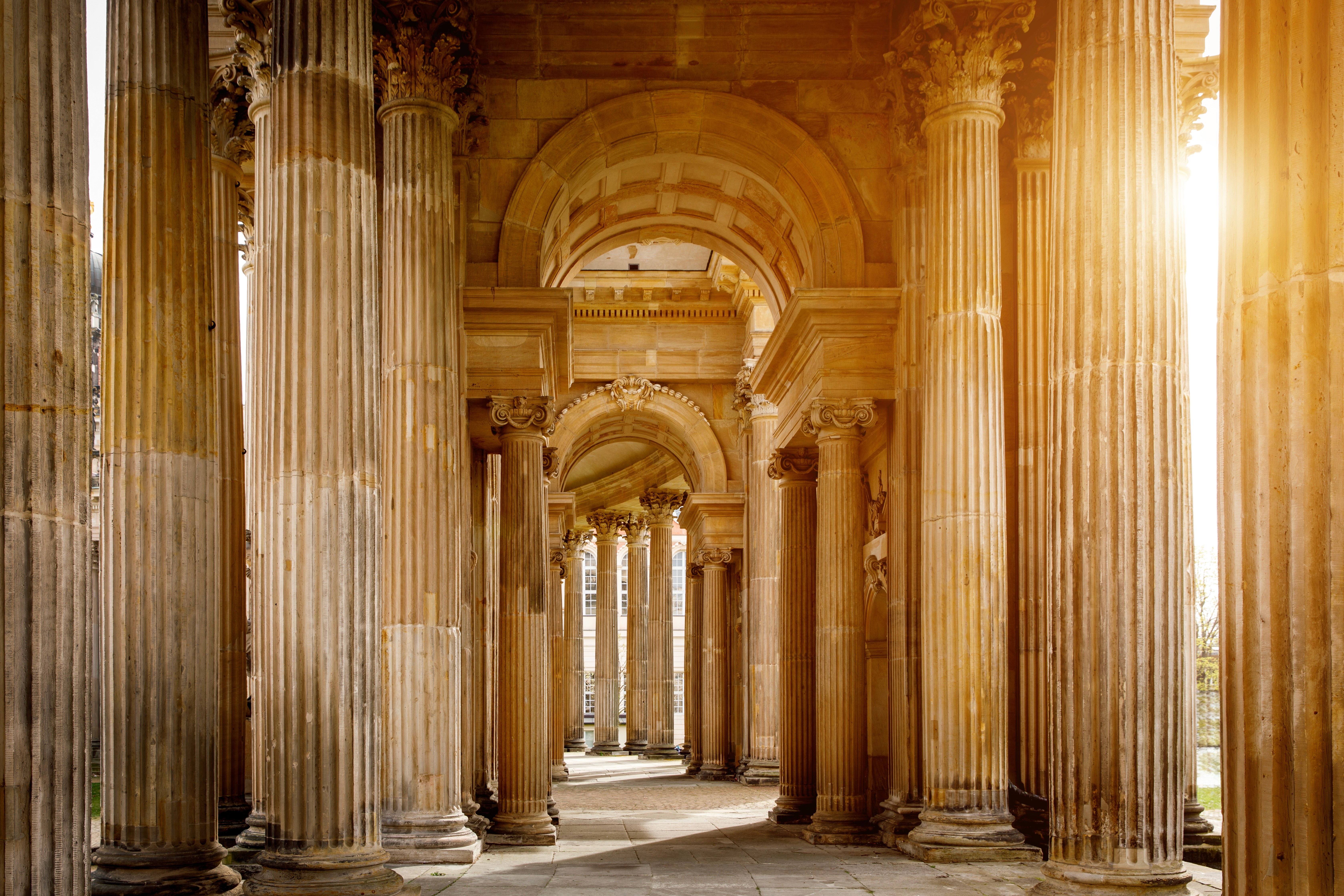Classical stone columns symbolising governance, clarity, and the structural integrity of multi-jurisdictional wealth frameworks.