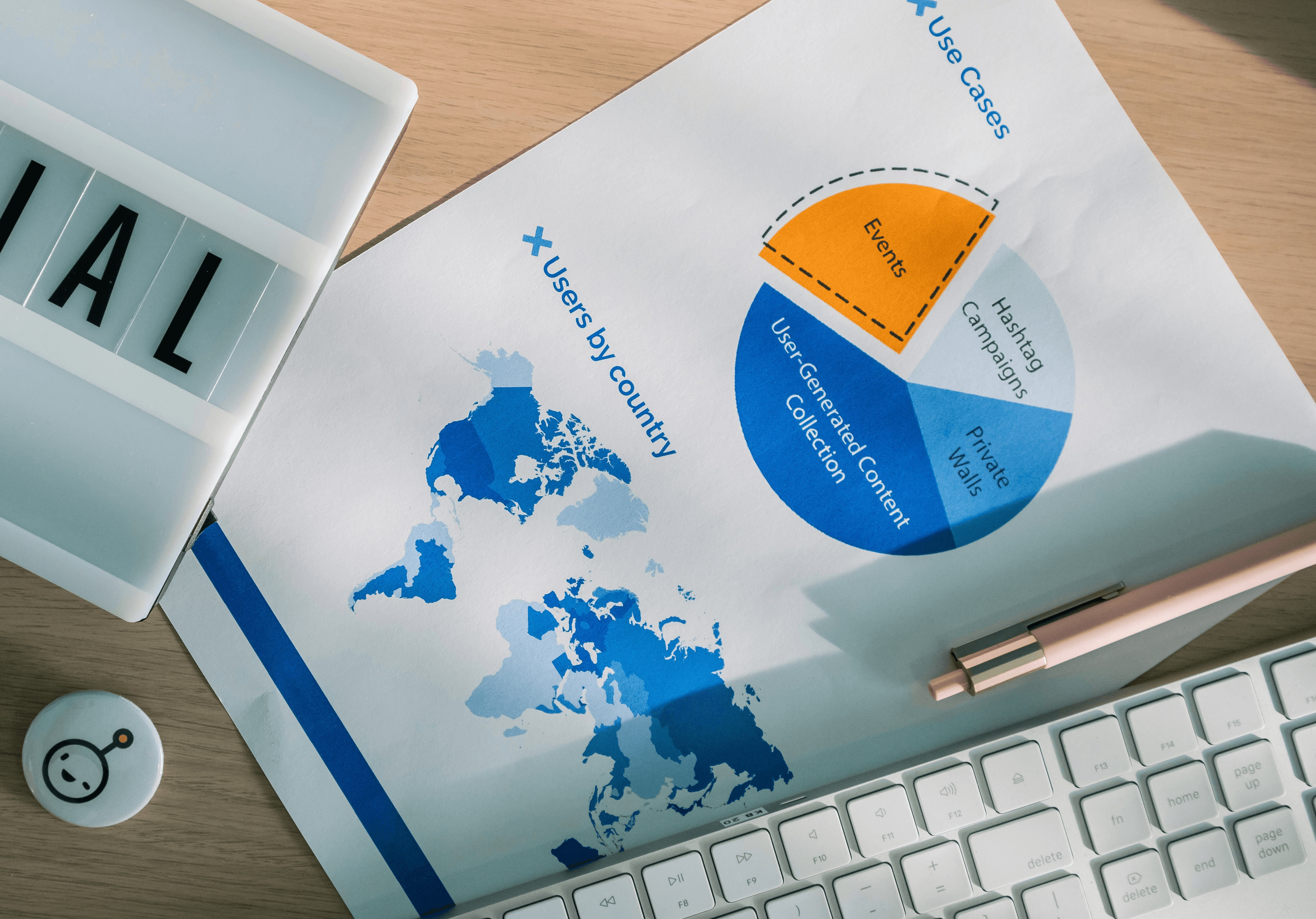 a piece of paper sitting on top of a desk next to a keyboard